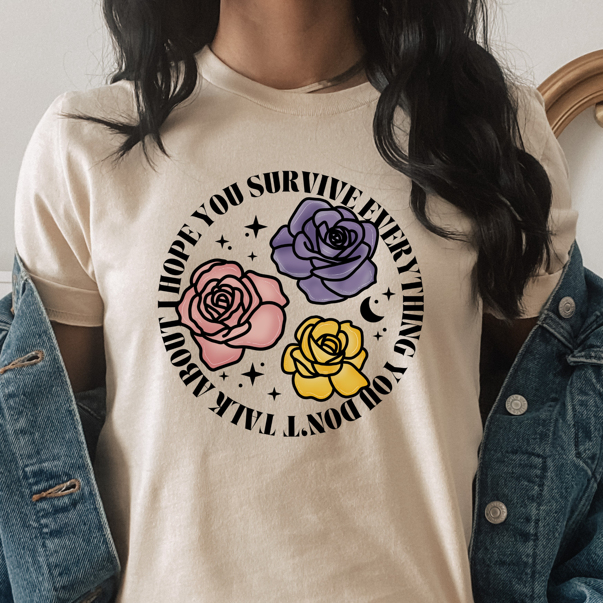 Inspirational floral shirt design featuring three roses in pink, lavender, and yellow with the phrase "I Hope You Survive Everything You Don't Talk About." Mental Health Awareness, Inspirational Shirt, Floral Shirt, Rose Shirt, Encouragement Gift, Self Care Apparel, Positive Message Tee, Inspirational Tee, Floral Graphic Shirt, Unisex T-Shirt, Wellness Apparel, Support Gift, Meaningful Clothing, Floral Fashion, Motivational Shirt, Kindness Matters, Mental Health Support, Graphic Tee, Gift For Her, Gift For 