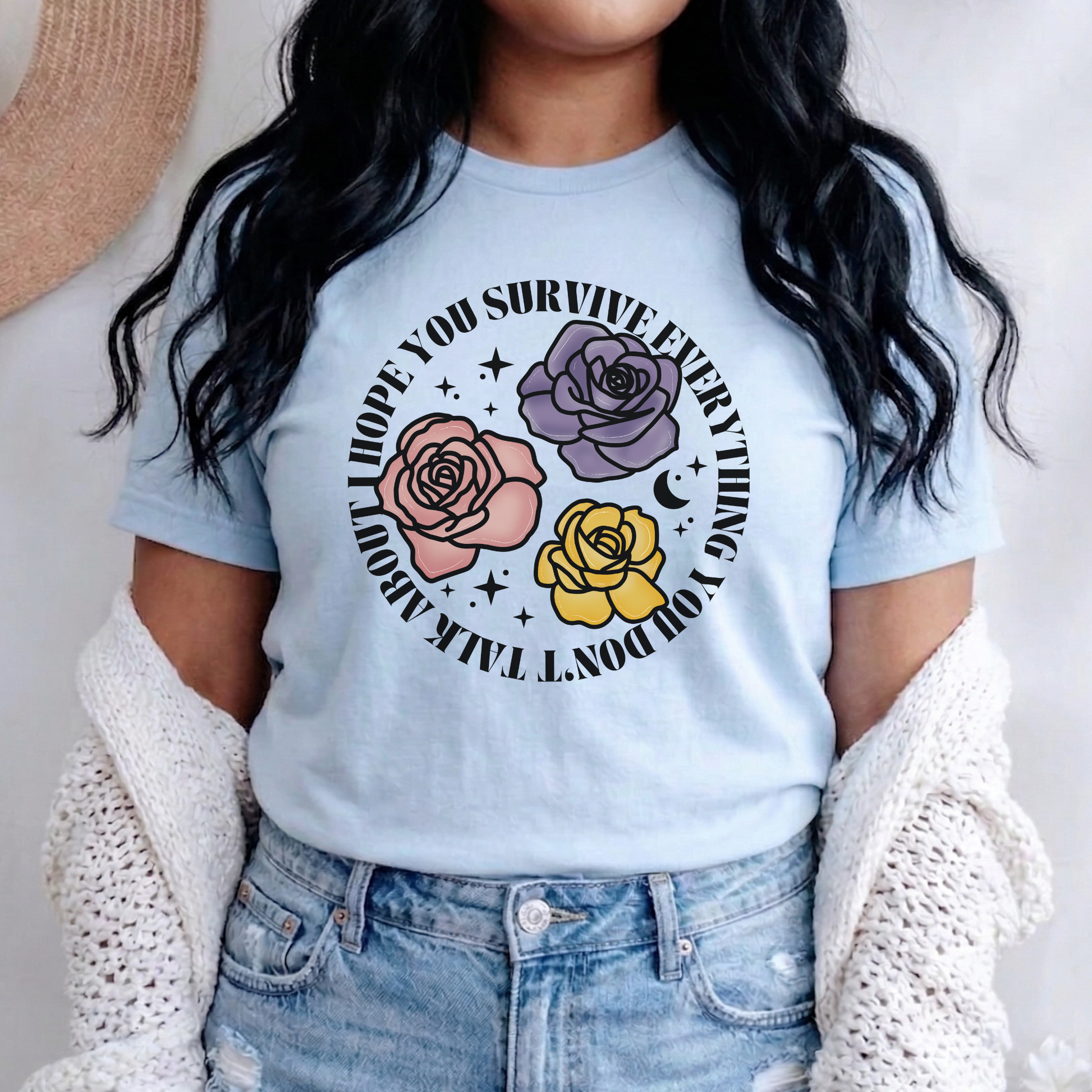 Inspirational floral shirt design featuring three roses in pink, lavender, and yellow with the phrase "I Hope You Survive Everything You Don't Talk About." Mental Health Awareness, Inspirational Shirt, Floral Shirt, Rose Shirt, Encouragement Gift, Self Care Apparel, Positive Message Tee, Inspirational Tee, Floral Graphic Shirt, Unisex T-Shirt, Wellness Apparel, Support Gift, Meaningful Clothing, Floral Fashion, Motivational Shirt, Kindness Matters, Mental Health Support, Graphic Tee, Gift For Her, Gift For 