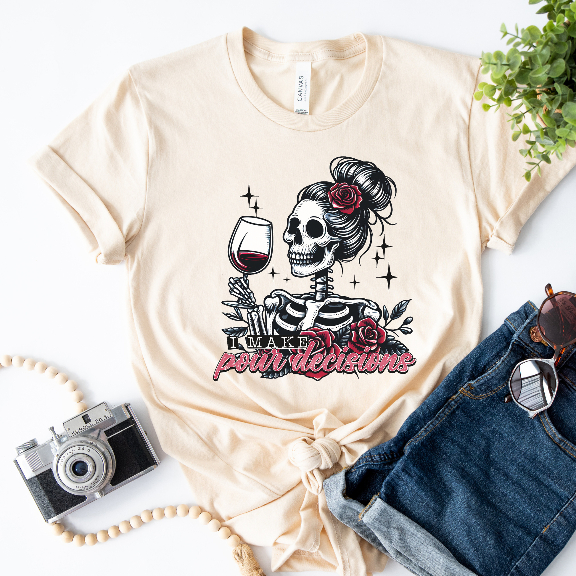 I Make Pour Decisions Shirt featuring a skeleton holding a glass of red wine with roses, sparkles, and funny wine-themed lettering. i make pour decisions shirt, wine lover shirt, funny wine shirt, wine mom shirt, skeleton wine shirt, wine drinking shirt, wine pun shirt, funny mom shirt, girls wine night shirt, vineyard outfit, spooky wine shirt, halloween wine shirt, wine enthusiast gift, wine tasting shirt, gothic wine shirt, funny drinking shirt, girls trip shirt, wine lover gift, skeleton shirt, wine hum