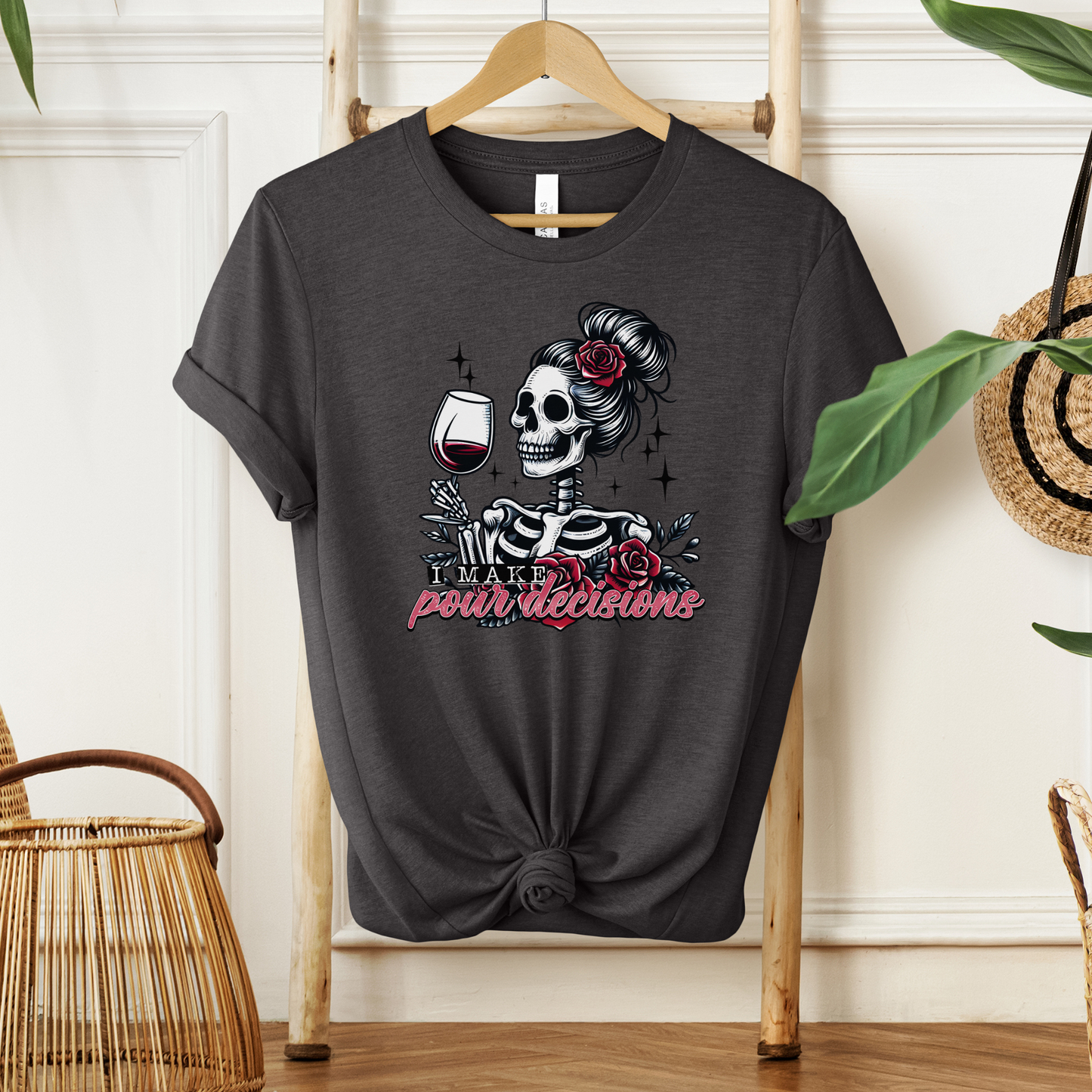 I Make Pour Decisions Shirt featuring a skeleton holding a glass of red wine with roses, sparkles, and funny wine-themed lettering. i make pour decisions shirt, wine lover shirt, funny wine shirt, wine mom shirt, skeleton wine shirt, wine drinking shirt, wine pun shirt, funny mom shirt, girls wine night shirt, vineyard outfit, spooky wine shirt, halloween wine shirt, wine enthusiast gift, wine tasting shirt, gothic wine shirt, funny drinking shirt, girls trip shirt, wine lover gift, skeleton shirt, wine hum