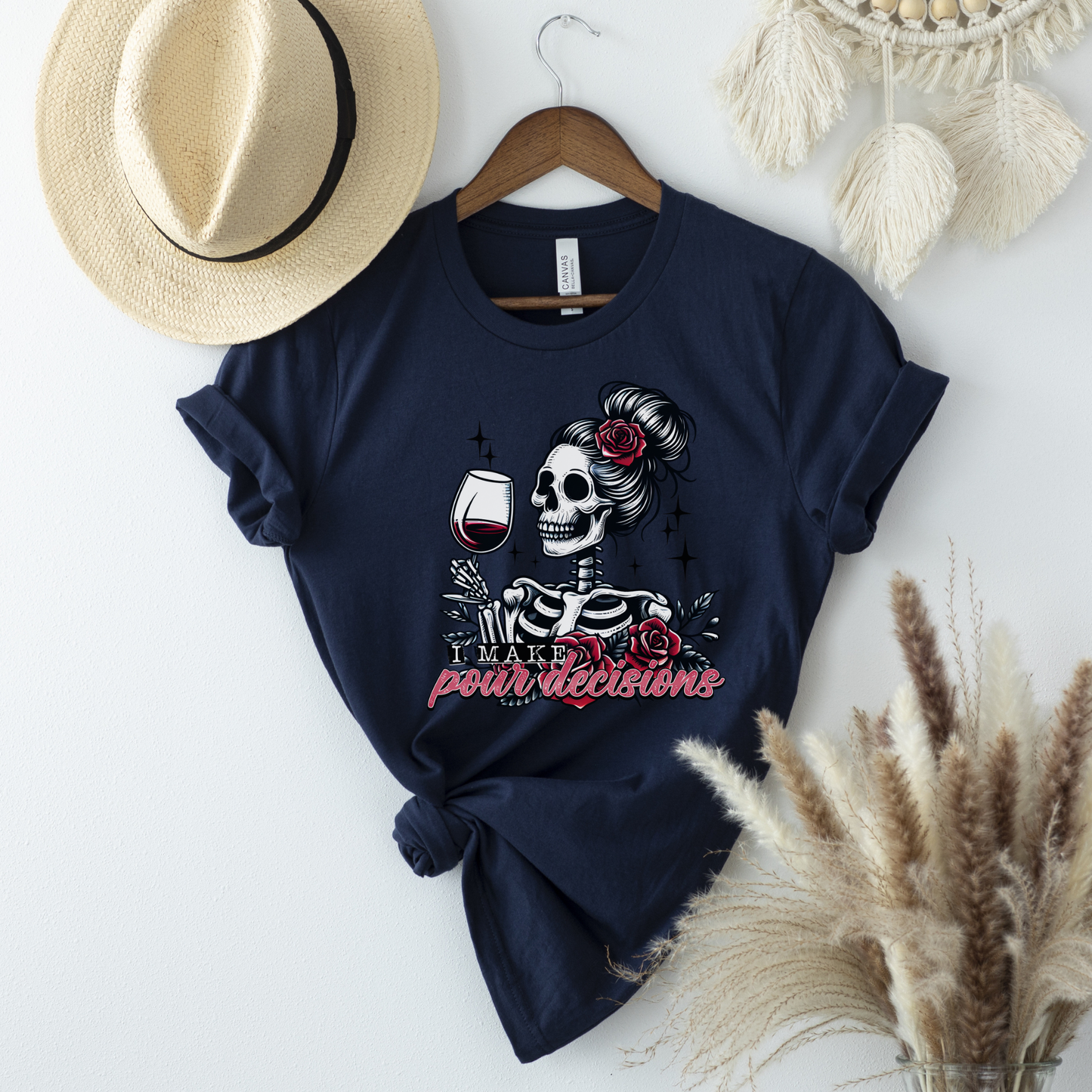 I Make Pour Decisions Shirt featuring a skeleton holding a glass of red wine with roses, sparkles, and funny wine-themed lettering. i make pour decisions shirt, wine lover shirt, funny wine shirt, wine mom shirt, skeleton wine shirt, wine drinking shirt, wine pun shirt, funny mom shirt, girls wine night shirt, vineyard outfit, spooky wine shirt, halloween wine shirt, wine enthusiast gift, wine tasting shirt, gothic wine shirt, funny drinking shirt, girls trip shirt, wine lover gift, skeleton shirt, wine hum