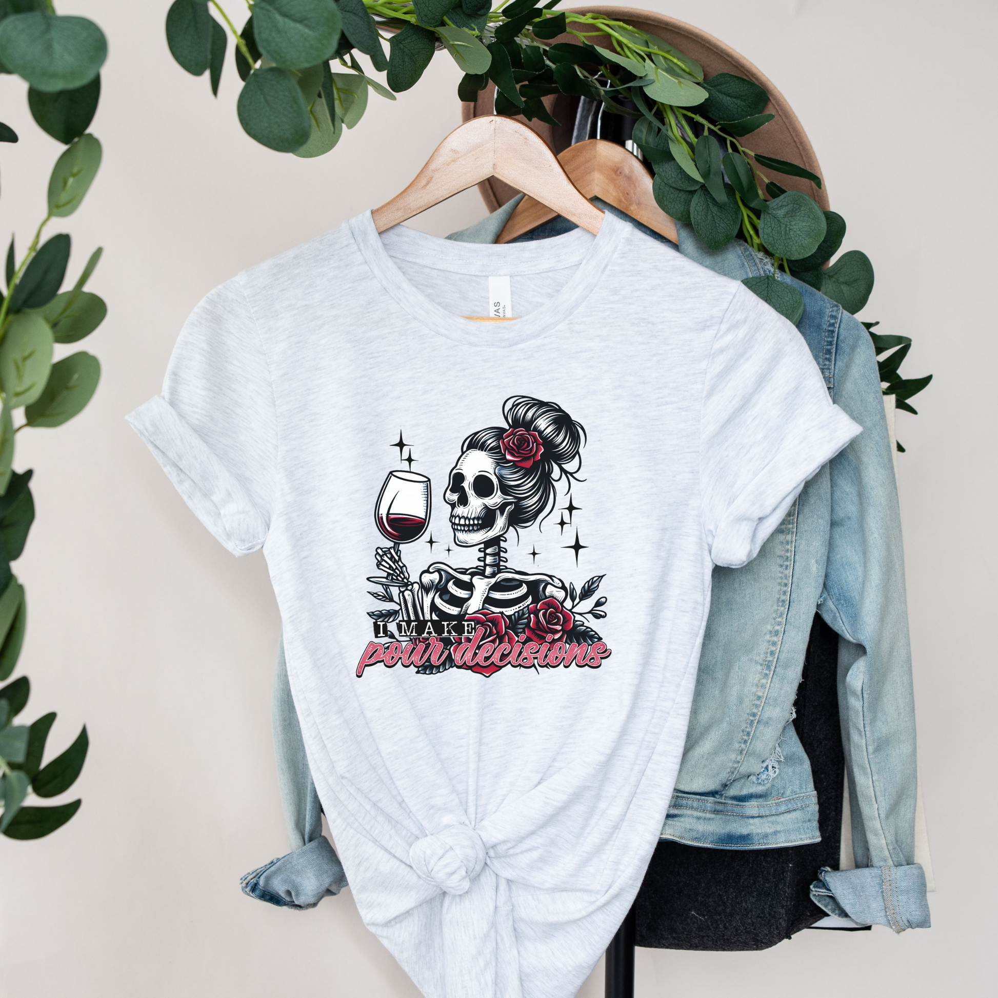 I Make Pour Decisions Shirt featuring a skeleton holding a glass of red wine with roses, sparkles, and funny wine-themed lettering. i make pour decisions shirt, wine lover shirt, funny wine shirt, wine mom shirt, skeleton wine shirt, wine drinking shirt, wine pun shirt, funny mom shirt, girls wine night shirt, vineyard outfit, spooky wine shirt, halloween wine shirt, wine enthusiast gift, wine tasting shirt, gothic wine shirt, funny drinking shirt, girls trip shirt, wine lover gift, skeleton shirt, wine hum