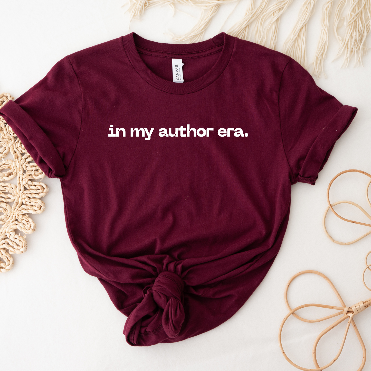 Maroon t-shirt with 'in my author era.' text on a light background. in my author era shirt, writer shirt, author tee, writing shirt, nanowrimo shirt, book author apparel, novelist shirt, writer gift shirt, author era tee, creative writer clothing, book launch shirt, writing community tee, aspiring author shirt, fiction writer apparel, manuscript shirt