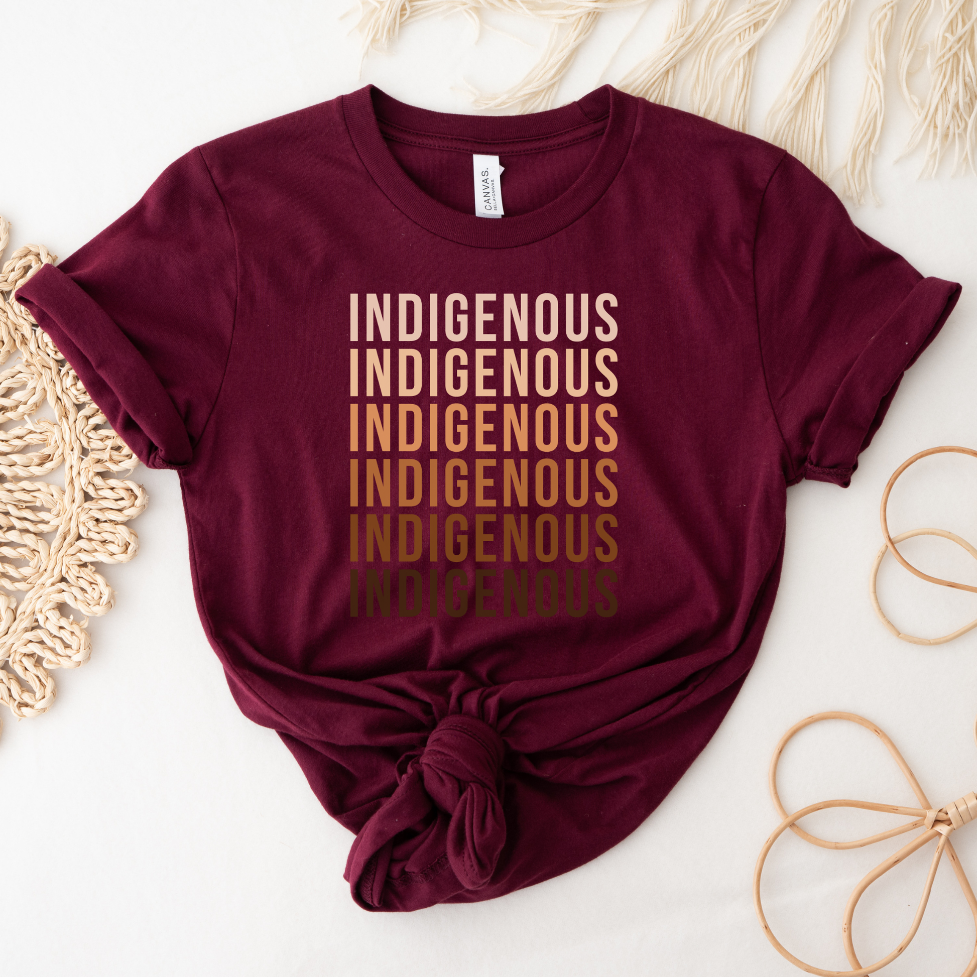 Maroon t-shirt with 'Indigenous' printed repeatedly on a light background Indigenous shirt, Indigenous repeated words shirt, Indigenous pride, Native apparel, Indigenous graphic tee, statement shirt, unisex t shirt, bold typography shirt, Indigenous identity, cultural pride tee, Indigenous clothing, modern graphic tee, awareness shirt, Native inspired fashion, everyday tee