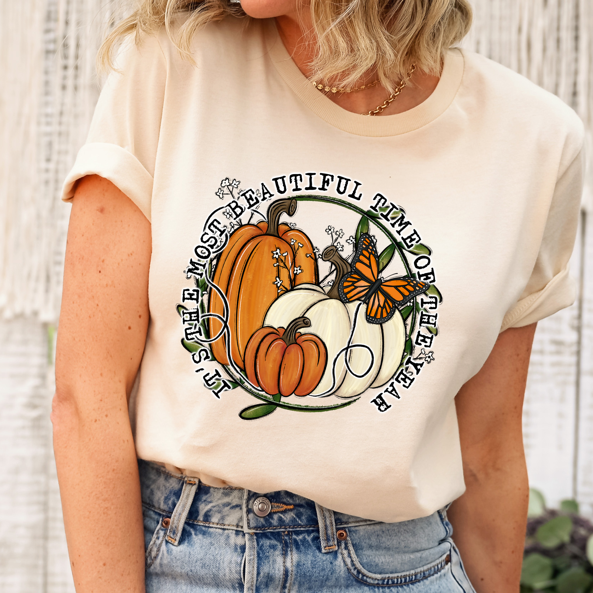 unisex t-shirt featuring pumpkins, a monarch butterfly, leafy accents, and the phrase "It's The Most Beautiful Time Of The Year" in a circular autumn-inspired design. it's the most beautiful time of the year shirt, fall shirt, autumn shirt, pumpkin shirt, pumpkin season shirt, thanksgiving shirt, fall graphic tee, cozy autumn shirt, pumpkin patch shirt, sweater weather shirt, fall aesthetic, harvest shirt, halloween shirt, pumpkin lover gift, autumn outfit, farmhouse fall decor shirt, monarch butterfly