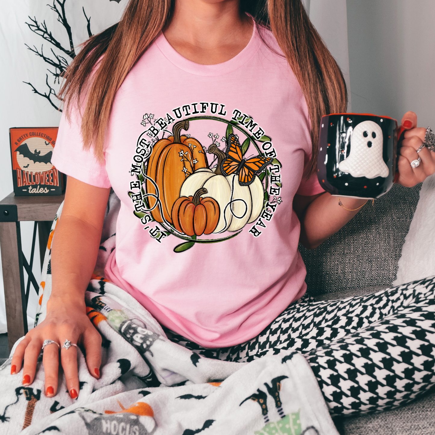 unisex t-shirt featuring pumpkins, a monarch butterfly, leafy accents, and the phrase "It's The Most Beautiful Time Of The Year" in a circular autumn-inspired design. it's the most beautiful time of the year shirt, fall shirt, autumn shirt, pumpkin shirt, pumpkin season shirt, thanksgiving shirt, fall graphic tee, cozy autumn shirt, pumpkin patch shirt, sweater weather shirt, fall aesthetic, harvest shirt, halloween shirt, pumpkin lover gift, autumn outfit, farmhouse fall decor shirt, monarch butterfly