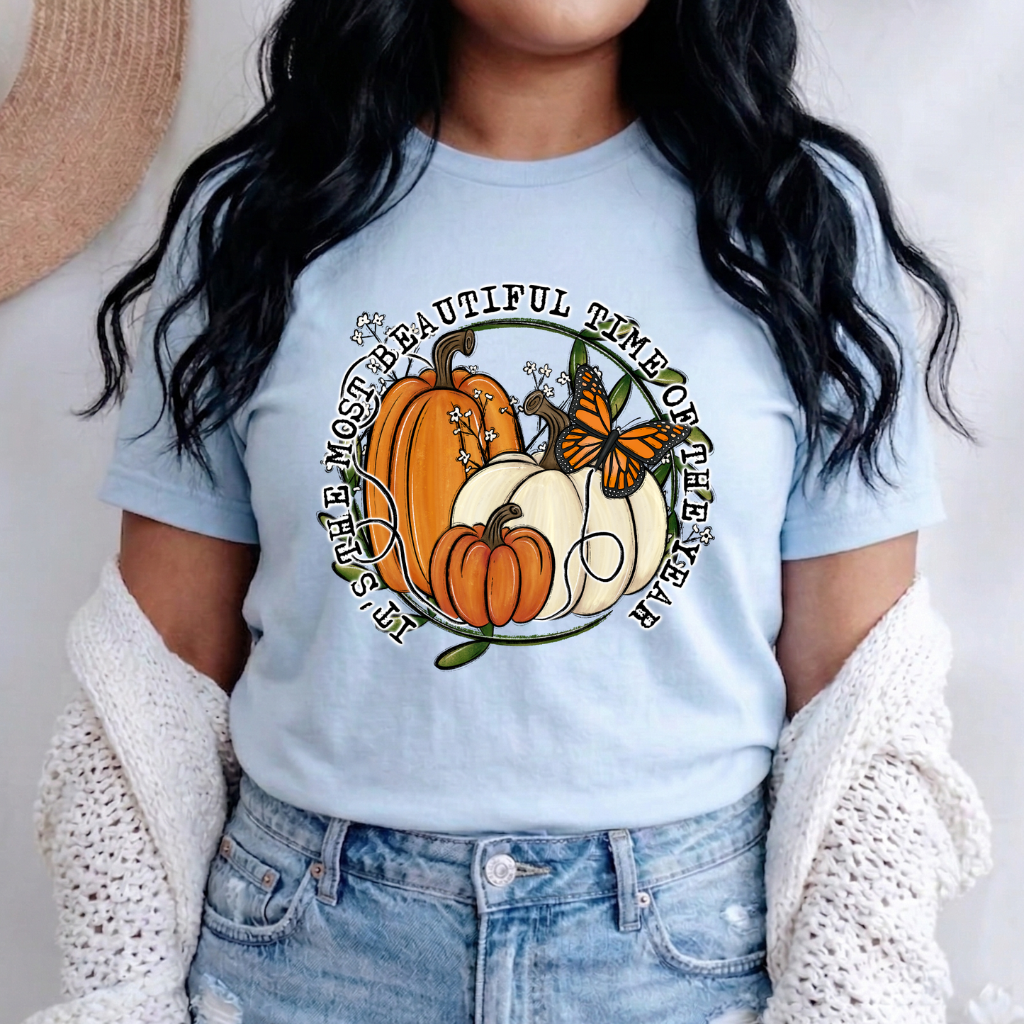 unisex t-shirt featuring pumpkins, a monarch butterfly, leafy accents, and the phrase "It's The Most Beautiful Time Of The Year" in a circular autumn-inspired design. it's the most beautiful time of the year shirt, fall shirt, autumn shirt, pumpkin shirt, pumpkin season shirt, thanksgiving shirt, fall graphic tee, cozy autumn shirt, pumpkin patch shirt, sweater weather shirt, fall aesthetic, harvest shirt, halloween shirt, pumpkin lover gift, autumn outfit, farmhouse fall decor shirt, monarch butterfly