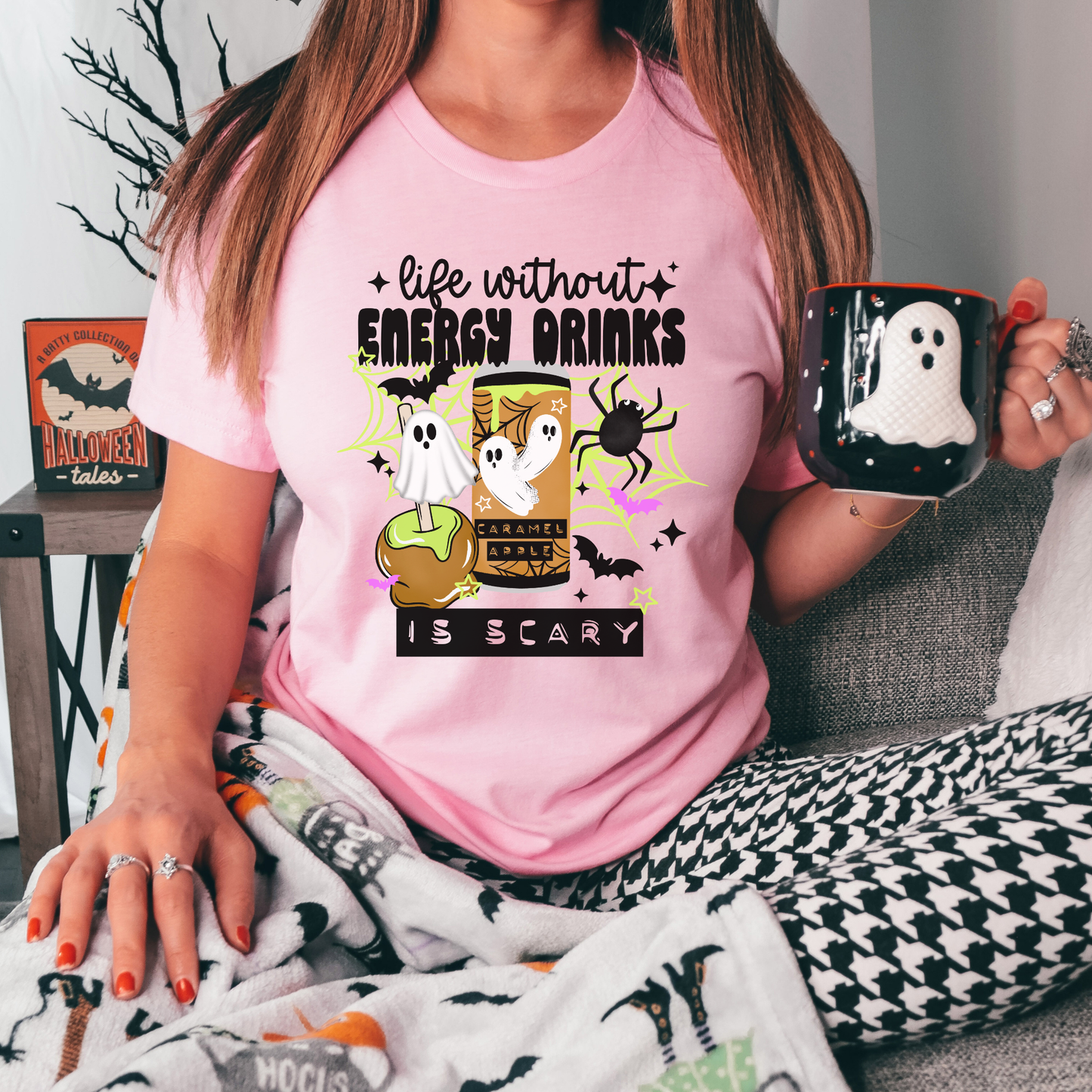 Funny Life Without Energy Drinks Is Scary Halloween shirt with ghosts, bats, spider webs, caramel apple, and spooky energy drink design. life without energy drinks is scary shirt, funny halloween shirt, energy drink shirt, caffeine lover shirt, halloween ghost shirt, spooky season shirt, funny fall shirt, halloween graphic tee, gamer shirt, nurse halloween shirt, teacher halloween shirt, student shirt, caffeine addict shirt, halloween apparel, caramel apple shirt, ghost aesthetic shirt, spooky cute shirt
