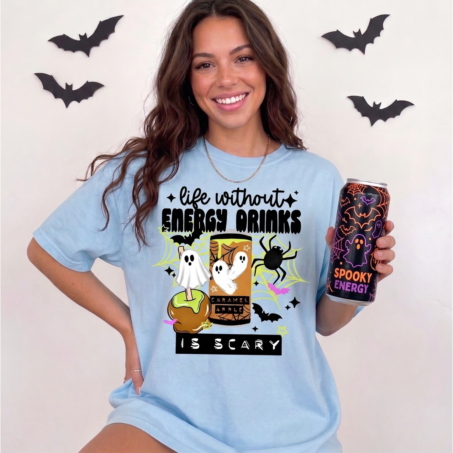 Funny Life Without Energy Drinks Is Scary Halloween shirt with ghosts, bats, spider webs, caramel apple, and spooky energy drink design. life without energy drinks is scary shirt, funny halloween shirt, energy drink shirt, caffeine lover shirt, halloween ghost shirt, spooky season shirt, funny fall shirt, halloween graphic tee, gamer shirt, nurse halloween shirt, teacher halloween shirt, student shirt, caffeine addict shirt, halloween apparel, caramel apple shirt, ghost aesthetic shirt, spooky cute shirt