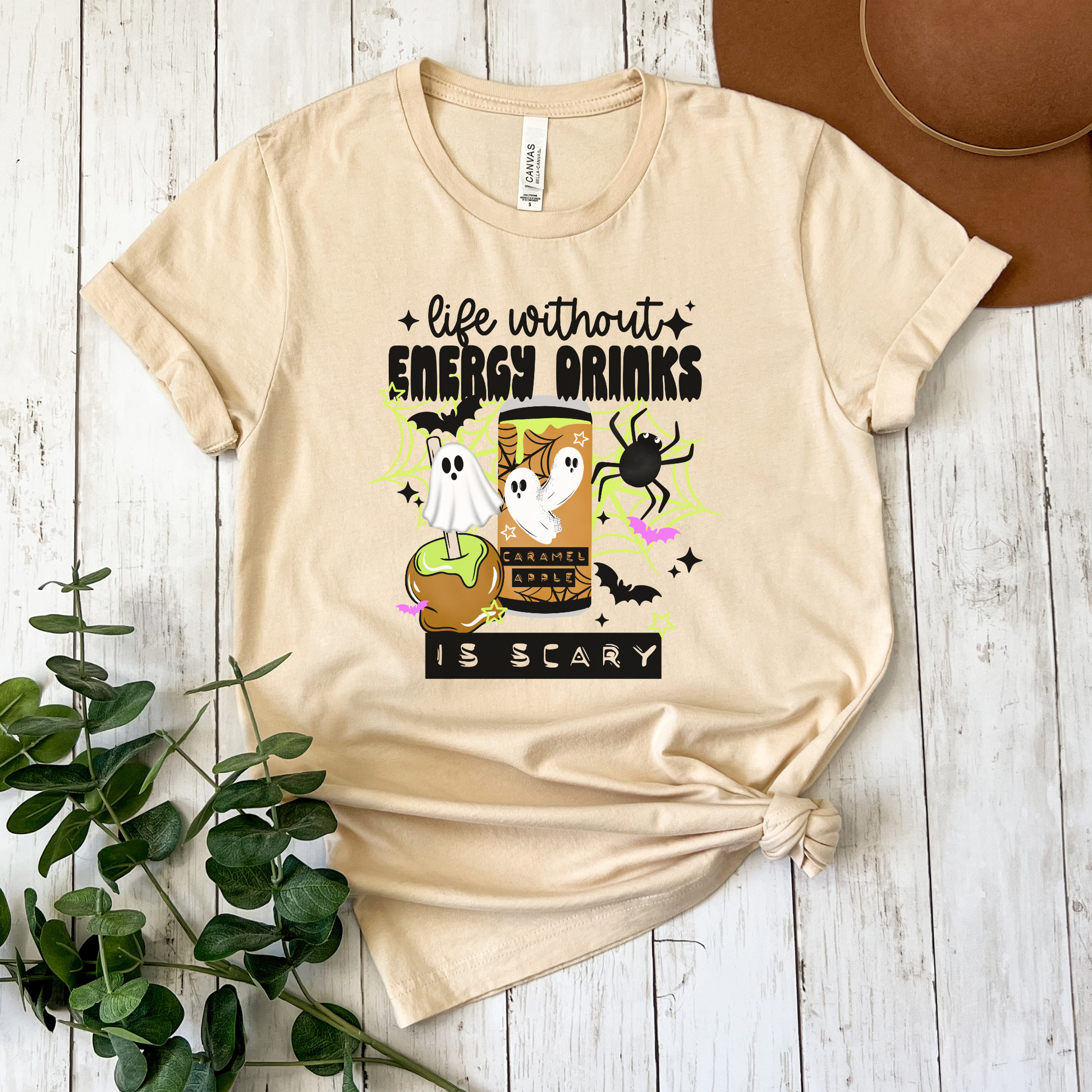 Funny Life Without Energy Drinks Is Scary Halloween shirt with ghosts, bats, spider webs, caramel apple, and spooky energy drink design. life without energy drinks is scary shirt, funny halloween shirt, energy drink shirt, caffeine lover shirt, halloween ghost shirt, spooky season shirt, funny fall shirt, halloween graphic tee, gamer shirt, nurse halloween shirt, teacher halloween shirt, student shirt, caffeine addict shirt, halloween apparel, caramel apple shirt, ghost aesthetic shirt, spooky cute shirt