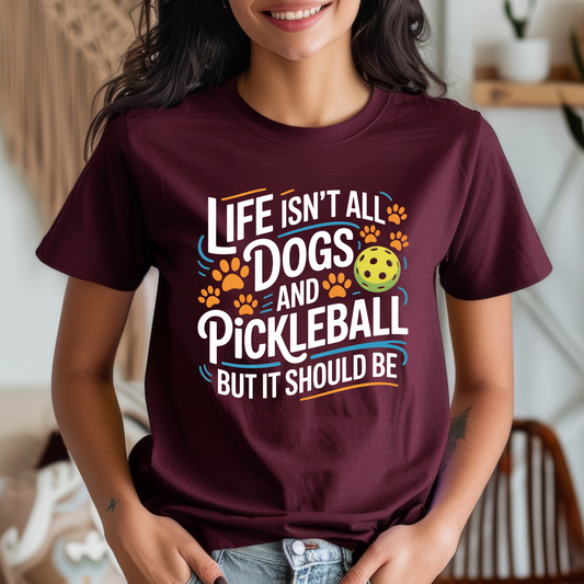 Life Isn’t All Dogs and Pickleball But It Should Be shirt, funny pickleball and dog lover graphic tee, unisex casual t-shirt design, pickleball shirt, dog lover shirt, funny pickleball tee, pickleball gift, dog mom shirt, dog dad shirt, sports graphic tee, pickleball outfit, cute dog shirt, funny dog shirt, pickleball apparel, unisex graphic tee, casual funny shirt