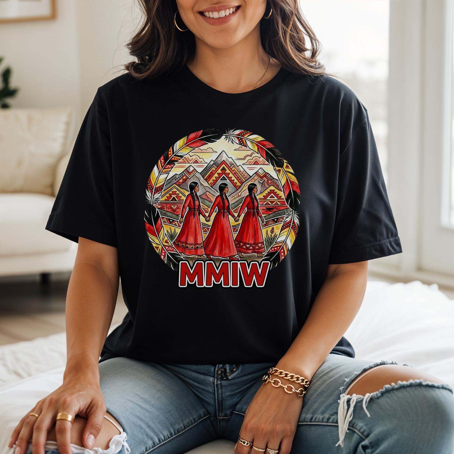 Person wearing a black t-shirt with a colorful design and 'MMIW' text in a living room. MMIW shirt, MMIW awareness, Indigenous t shirt, Missing and Murdered Indigenous Women, Indigenous graphic tee, Indigenous awareness shirt, unisex t shirt, activism shirt, Indigenous justice, Two Spirit awareness, Native apparel, awareness tee, Indigenous owned brand, feather frame shirt, statement t shirt