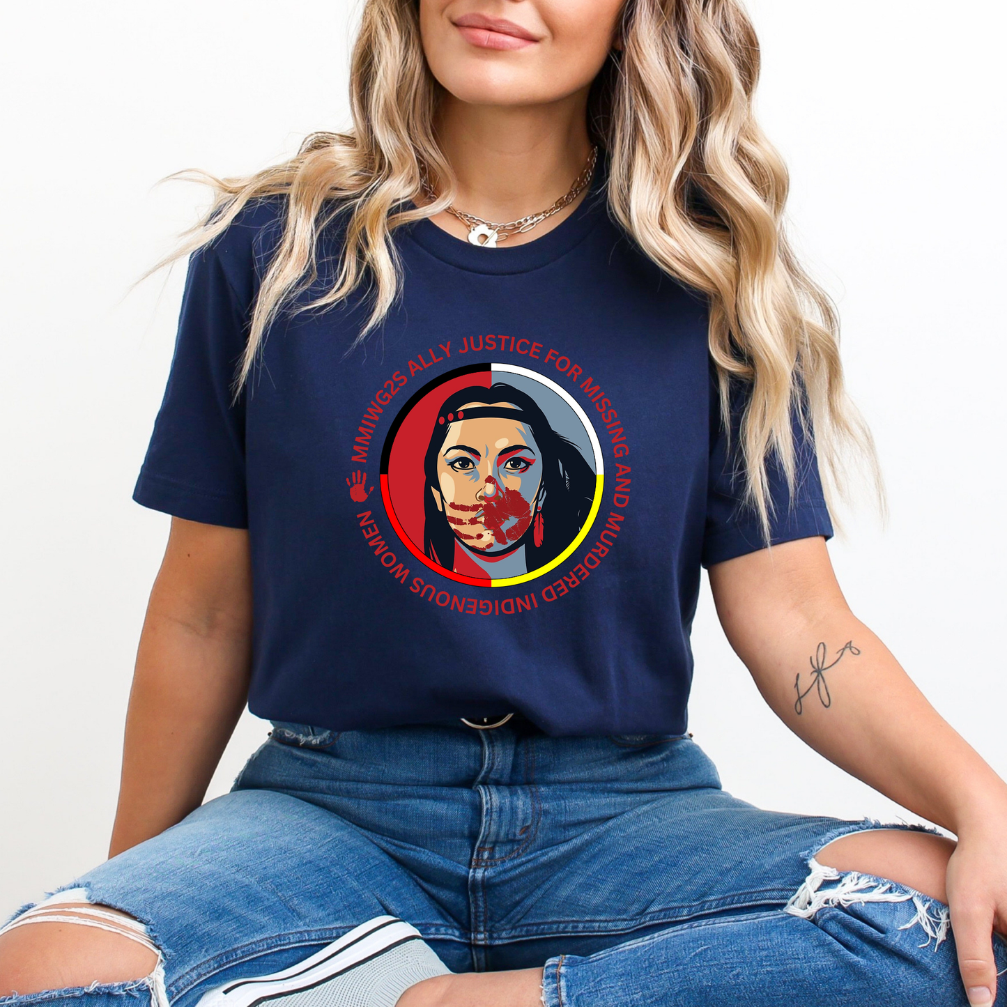 Person wearing a navy blue t-shirt with a graphic design and text. MMIWG2S shirt, Missing Murdered Indigenous Women tee, Indigenous ally shirt, MMIWG awareness apparel, justice for Indigenous women clothing, truth and reconciliation tee, National Day for Truth shirt, Indigenous activism clothing, 2SLGBTQQIA ally shirt, Canada missing women awareness, social justice tee, rally shirt Indigenous rights, solidarity shirt, awareness apparel Indigenous, activism t-shirt