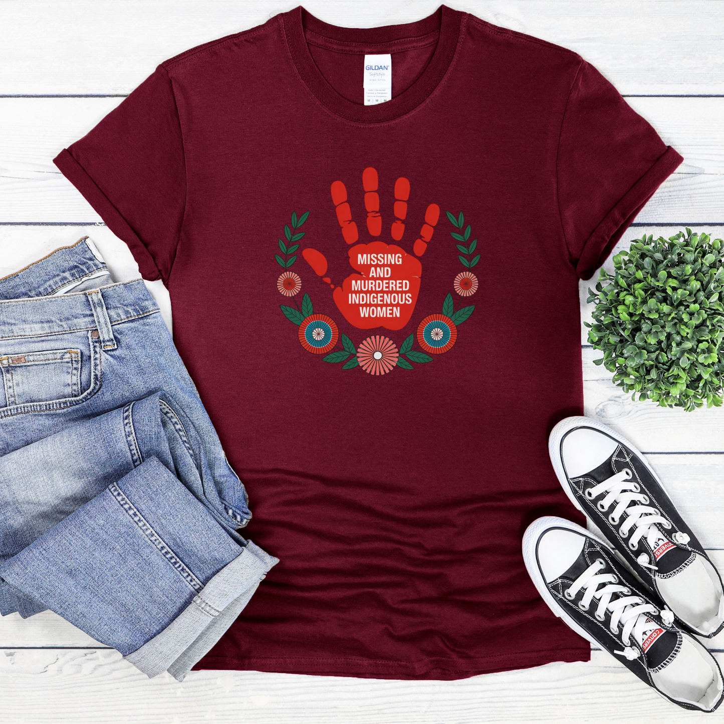 Maroon t-shirt with a handprint design and text, placed on a white surface with jeans and sneakers. MMIW shirt, Missing and Murdered Indigenous Women shirt, red handprint shirt, Indigenous awareness shirt, Indigenous rights shirt, MMIW awareness tee, solidarity shirt, social justice shirt, unisex awareness shirt, Canada Indigenous shirt, Indigenous activism clothing, reconciliation shirt, advocate shirt, meaningful graphic tee, awareness apparel