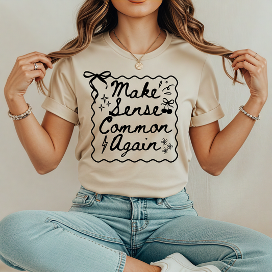 Make Sense Common Again shirt with hand-drawn doodle style text on a unisex graphic tee. make sense common again, funny quote shirt, sarcastic tee, doodle shirt, unisex graphic tee, humorous apparel, witty shirt, statement tee, casual funny shirt, everyday graphic tee, gift idea shirt, sarcastic quote tee, playful t shirt, funny unisex shirt, creative quote shirt. canadian shop funny shirt