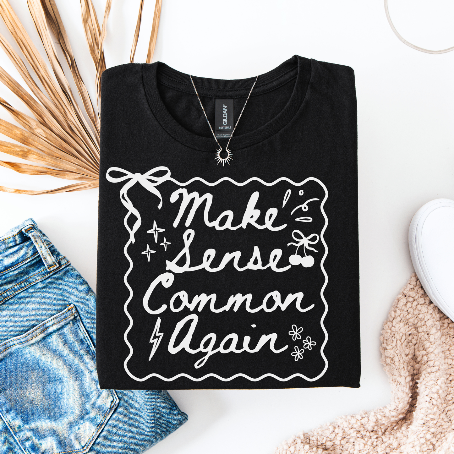 Make Sense Common Again shirt with hand-drawn doodle style text on a unisex graphic tee. make sense common again, funny quote shirt, sarcastic tee, doodle shirt, unisex graphic tee, humorous apparel, witty shirt, statement tee, casual funny shirt, everyday graphic tee, gift idea shirt, sarcastic quote tee, playful t shirt, funny unisex shirt, creative quote shirt. canadian shop funny shirt