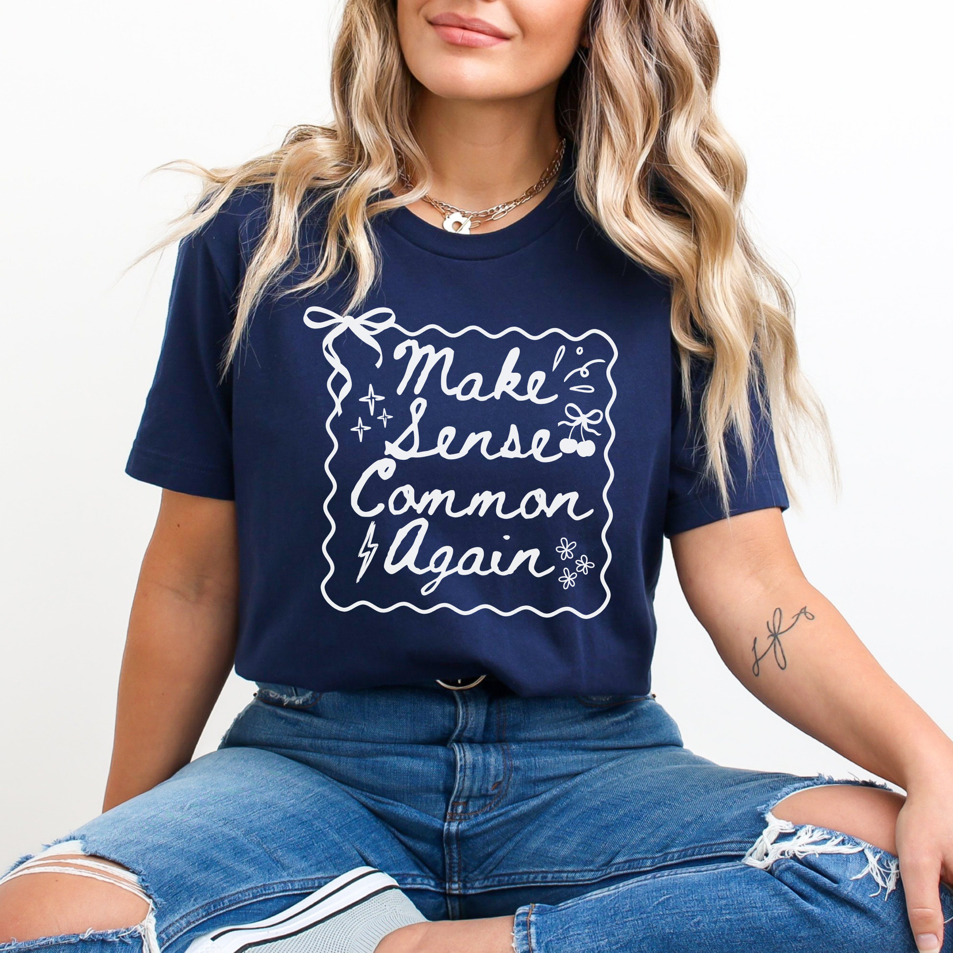 Make Sense Common Again shirt with hand-drawn doodle style text on a unisex graphic tee. make sense common again, funny quote shirt, sarcastic tee, doodle shirt, unisex graphic tee, humorous apparel, witty shirt, statement tee, casual funny shirt, everyday graphic tee, gift idea shirt, sarcastic quote tee, playful t shirt, funny unisex shirt, creative quote shirt. canadian shop funny shirt