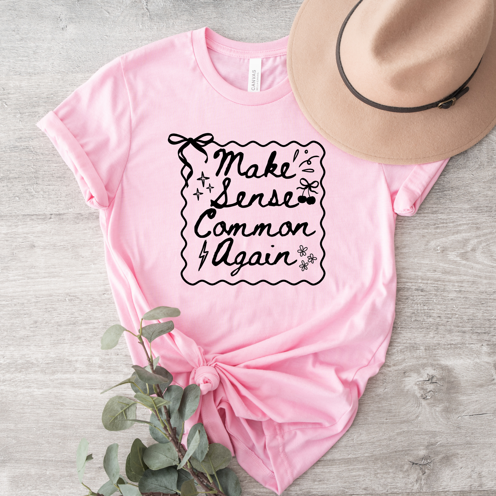 Make Sense Common Again shirt with hand-drawn doodle style text on a unisex graphic tee. make sense common again, funny quote shirt, sarcastic tee, doodle shirt, unisex graphic tee, humorous apparel, witty shirt, statement tee, casual funny shirt, everyday graphic tee, gift idea shirt, sarcastic quote tee, playful t shirt, funny unisex shirt, creative quote shirt. canadian shop funny shirt