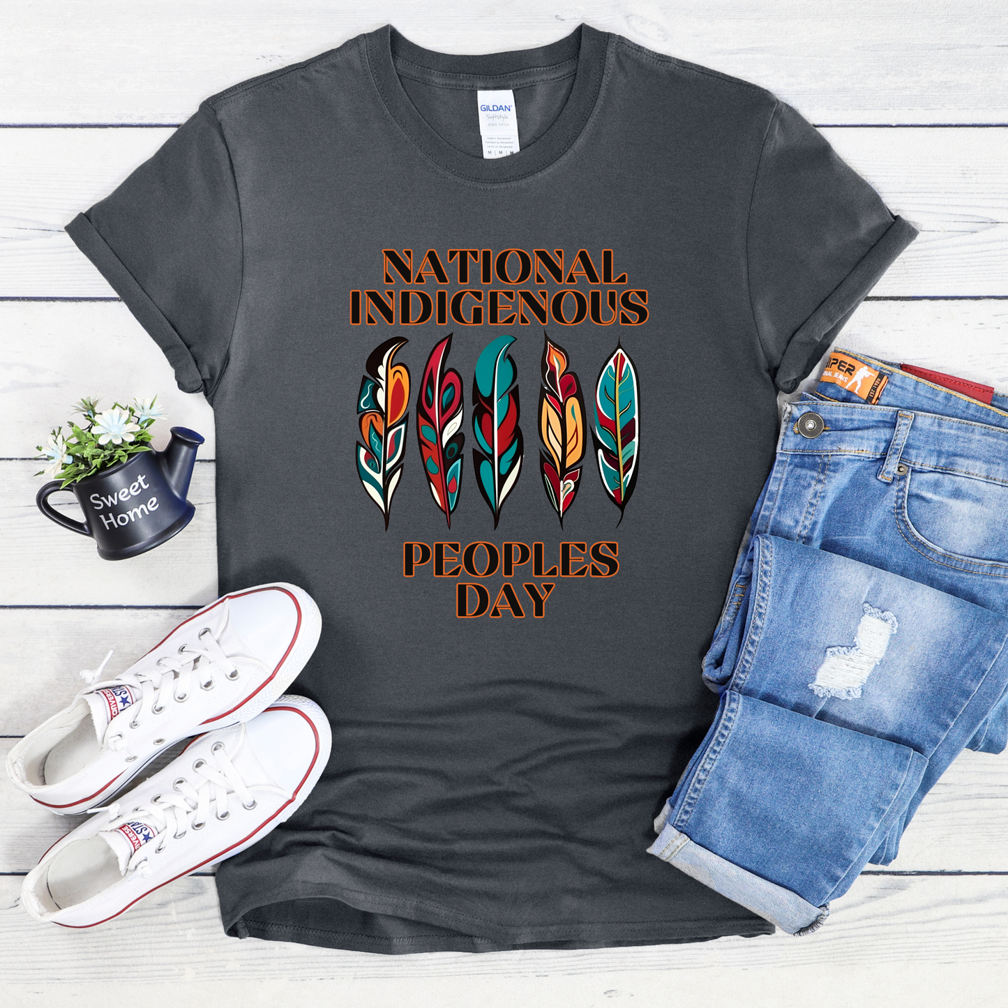 National Indigenous Peoples Day unisex t-shirt with feather graphic design on a comfortable everyday tee. National Indigenous Peoples Day shirt, Indigenous pride tee, feather shirt, unisex graphic tee, Indigenous apparel, cultural pride shirt, meaningful graphic tee, Indigenous celebration shirt, everyday unisex shirt, heritage clothing, awareness shirt, gift for Indigenous peoples day, feather design tee, casual cultural shirt, Indigenous day apparel, Indigenous history month shirt, Indigenous owned 