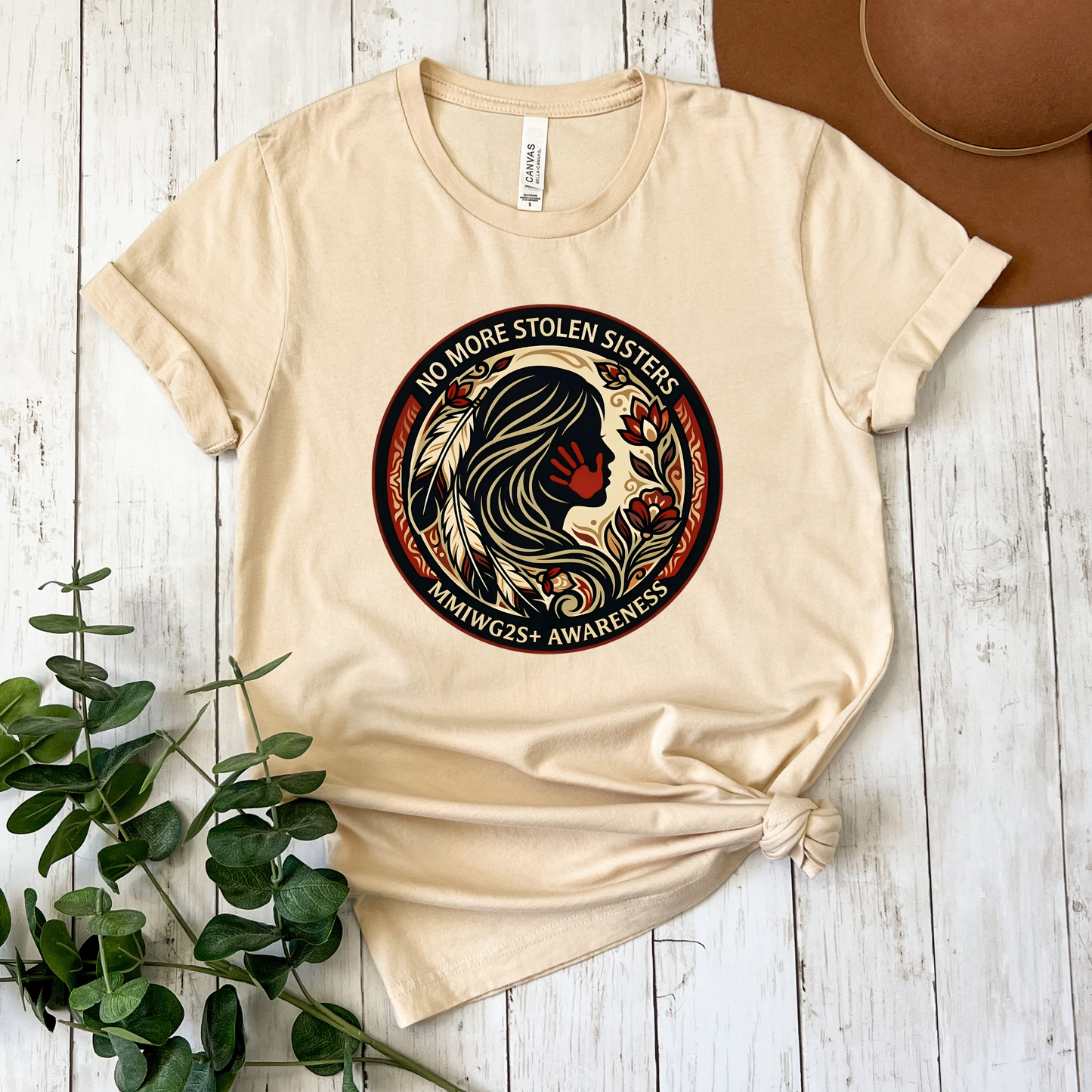 No More Stolen Sisters MMIWG2S+ awareness unisex t-shirt featuring powerful original graphic design calling for justice for Missing and Murdered Indigenous Women, Girls, and Two Spirit+ on soft heather cotton tee.