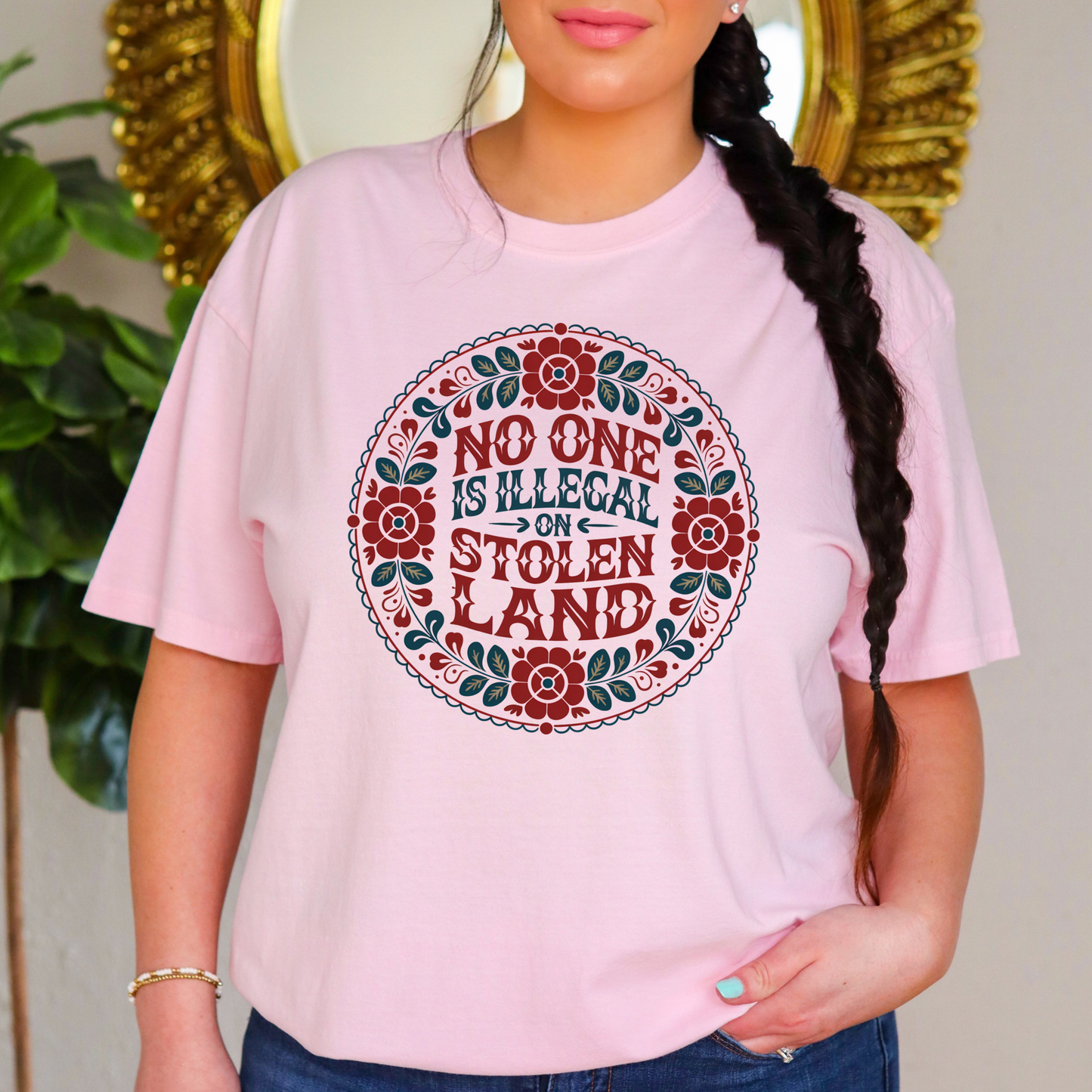 No one is illegal on stolen land tshirt, floral circle shirt, Indigenous floral tee, land back shirt, social justice t-shirt, stolen land circle design, activist floral apparel, Indigenous owned t-shirt, Sahdeh Spruce design, unisex activist tee, decolonization clothing, retro floral shirt, ethical fashion, protest graphic tee