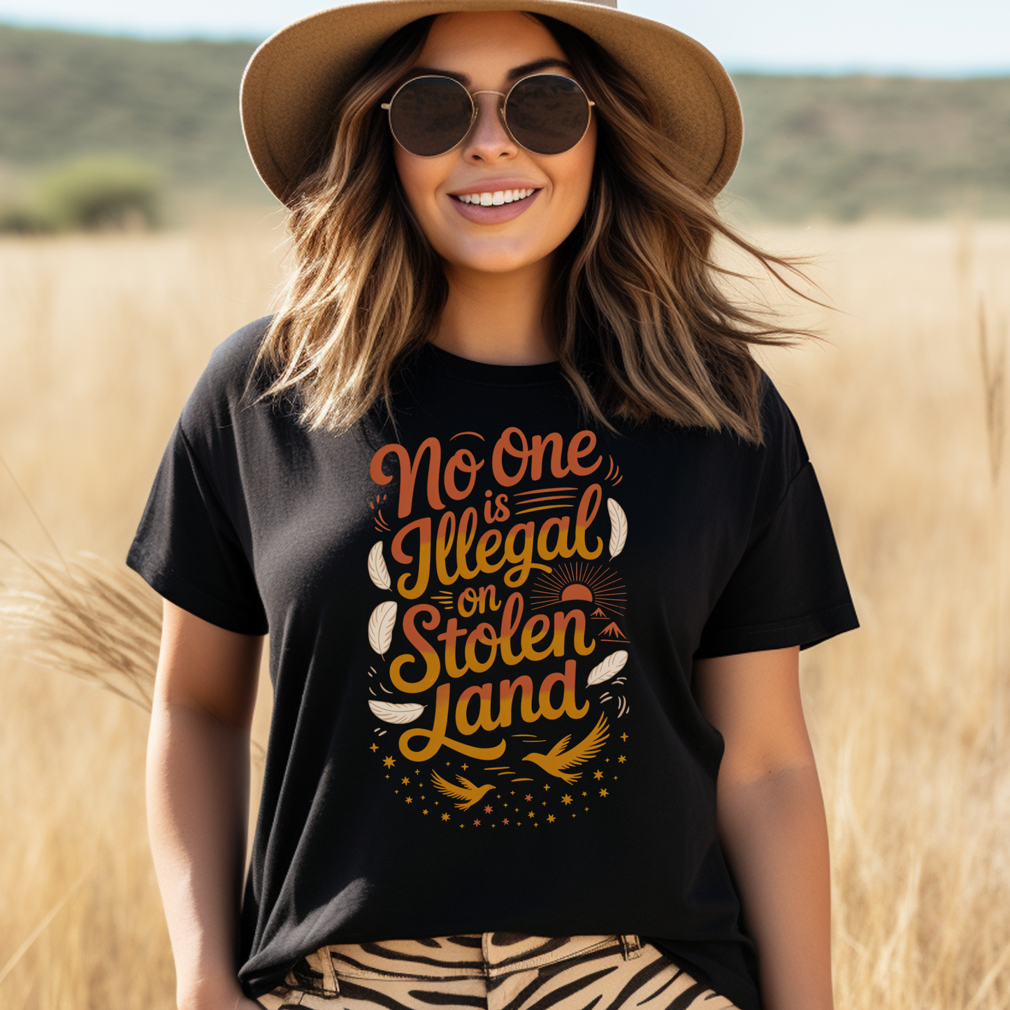 No one is illegal on stolen land t-shirt, Indigenous activist shirt, land back tee, social justice apparel, stolen land shirt, feather bird graphic tee, Indigenous owned t-shirt, Sahdeh Spruce design, unisex activist tee, decolonization clothing, ethical fashion, protest shirt, Native pride tee

