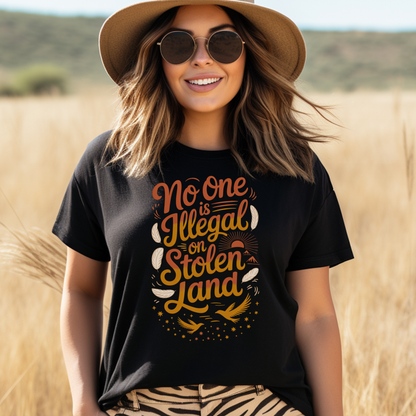No one is illegal on stolen land t-shirt, Indigenous activist shirt, land back tee, social justice apparel, stolen land shirt, feather bird graphic tee, Indigenous owned t-shirt, Sahdeh Spruce design, unisex activist tee, decolonization clothing, ethical fashion, protest shirt, Native pride tee

