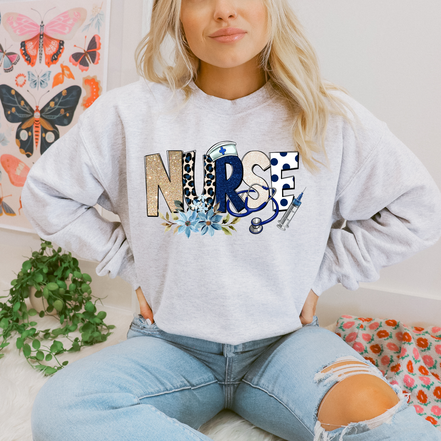 Cozy floral nurse crewneck sweatshirt featuring a stethoscope design. Perfect gift for nurses, RN, LPN, CNA, and nursing students. Ideal for Nurse Appreciation Week.