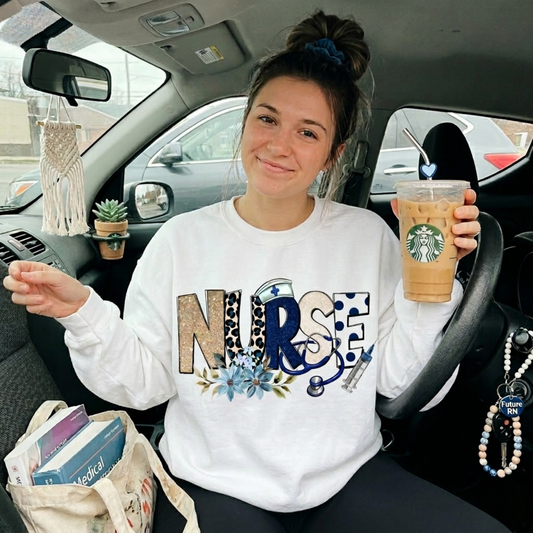 Cozy floral nurse crewneck sweatshirt featuring a stethoscope design. Perfect gift for nurses, RN, LPN, CNA, and nursing students. Ideal for Nurse Appreciation Week.