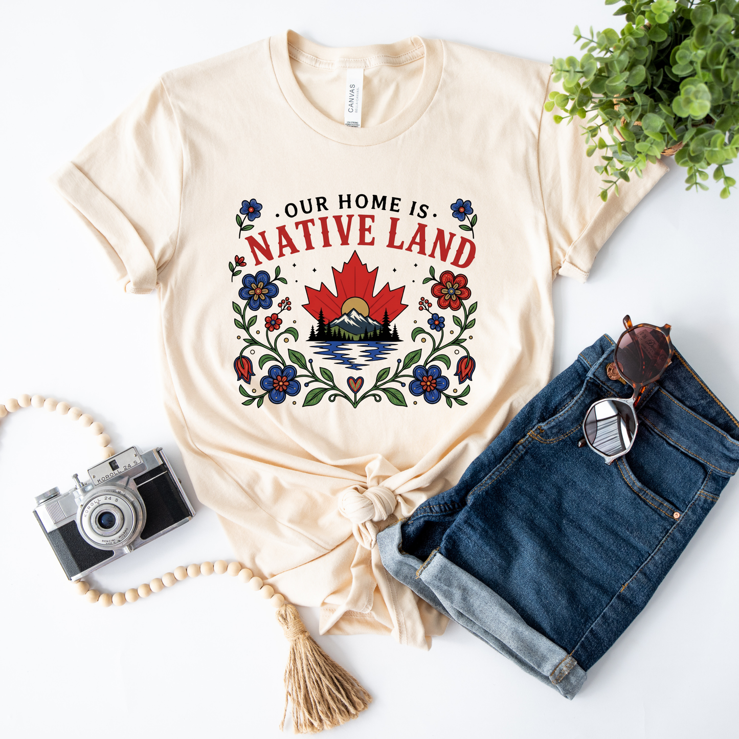 Our Home Is Native Land shirt, Indigenous Canada Day shirt, Indigenous floral maple leaf shirt, Native land graphic tee, Indigenous designed apparel, Indigenous-owned clothing, reconciliation shirt, National Indigenous Peoples Day shirt, Canadian mountain shirt, maple leaf floral shirt, Indigenous fashion Canada, Truth and Reconciliation apparel, Canadian landscape shirt, Indigenous artist shirt, support Indigenous business