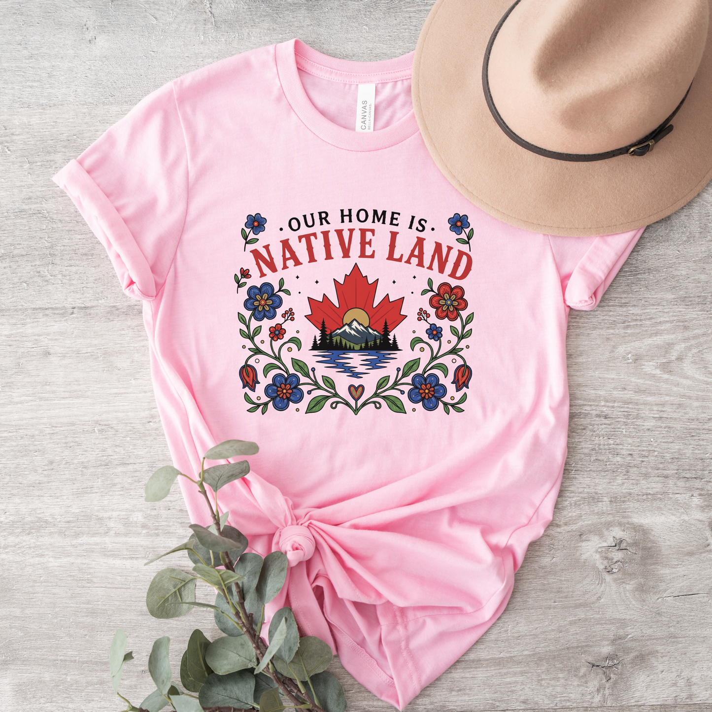 Our Home Is Native Land shirt, Indigenous Canada Day shirt, Indigenous floral maple leaf shirt, Native land graphic tee, Indigenous designed apparel, Indigenous-owned clothing, reconciliation shirt, National Indigenous Peoples Day shirt, Canadian mountain shirt, maple leaf floral shirt, Indigenous fashion Canada, Truth and Reconciliation apparel, Canadian landscape shirt, Indigenous artist shirt, support Indigenous business