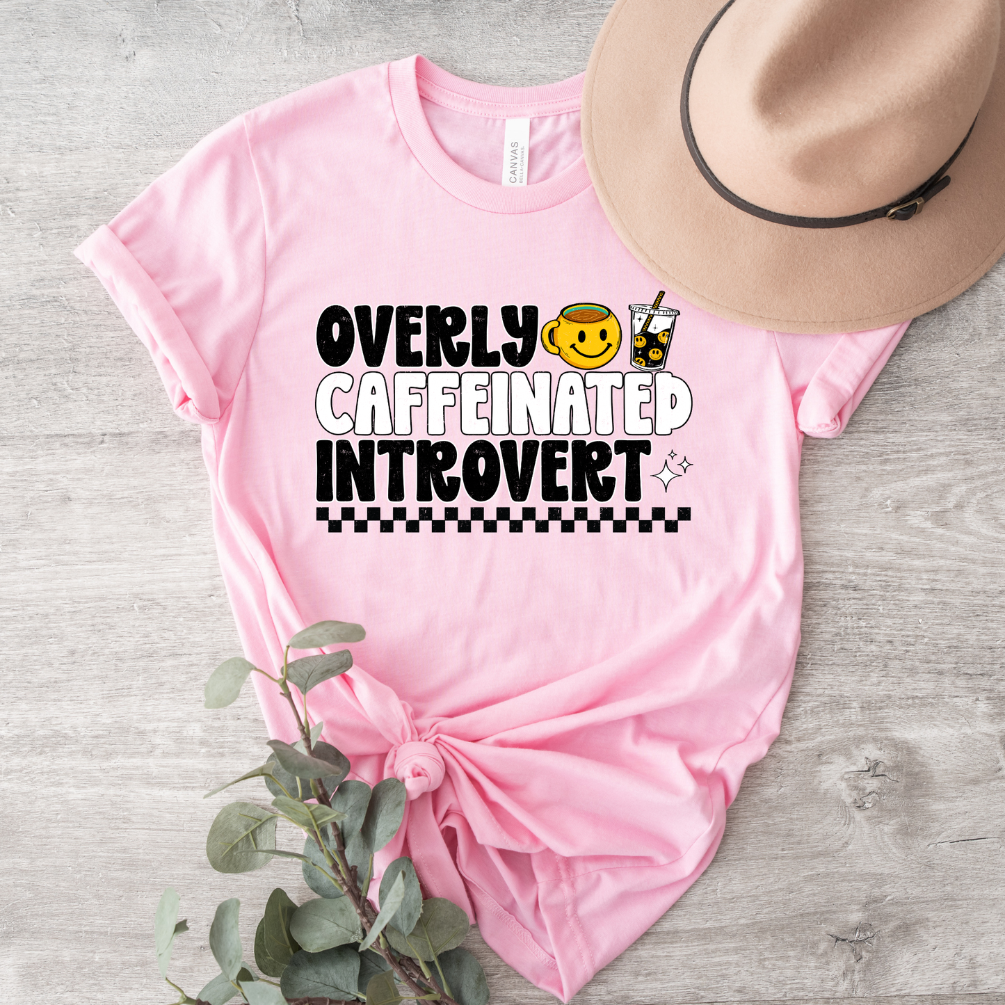 Overly caffeinated introvert shirt with bold coffee-themed graphic design on a tee, introvert shirt, coffee lover shirt, funny graphic tee, caffeine shirt, introvert gift, coffee graphic tee, sarcastic shirt, cozy casual shirt, funny woman shirt, relatable tee, caffeine addict shirt, everyday graphic tee, retro coffee shirt, minimalist graphic tee, gift for her, lounge tee, coffee run shirt, casual cotton tee, unisex graphic tee, quirky shirt