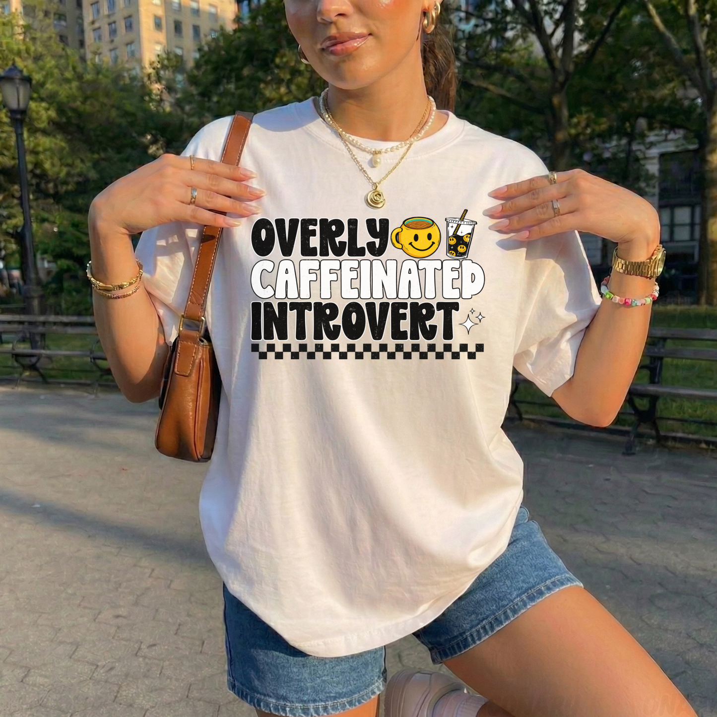 Overly caffeinated introvert shirt with bold coffee-themed graphic design on a tee, introvert shirt, coffee lover shirt, funny graphic tee, caffeine shirt, introvert gift, coffee graphic tee, sarcastic shirt, cozy casual shirt, funny woman shirt, relatable tee, caffeine addict shirt, everyday graphic tee, retro coffee shirt, minimalist graphic tee, gift for her, lounge tee, coffee run shirt, casual cotton tee, unisex graphic tee, quirky shirt
