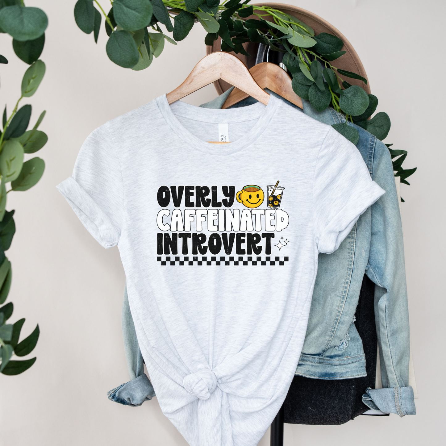 Overly caffeinated introvert shirt with bold coffee-themed graphic design on a tee, introvert shirt, coffee lover shirt, funny graphic tee, caffeine shirt, introvert gift, coffee graphic tee, sarcastic shirt, cozy casual shirt, funny woman shirt, relatable tee, caffeine addict shirt, everyday graphic tee, retro coffee shirt, minimalist graphic tee, gift for her, lounge tee, coffee run shirt, casual cotton tee, unisex graphic tee, quirky shirt