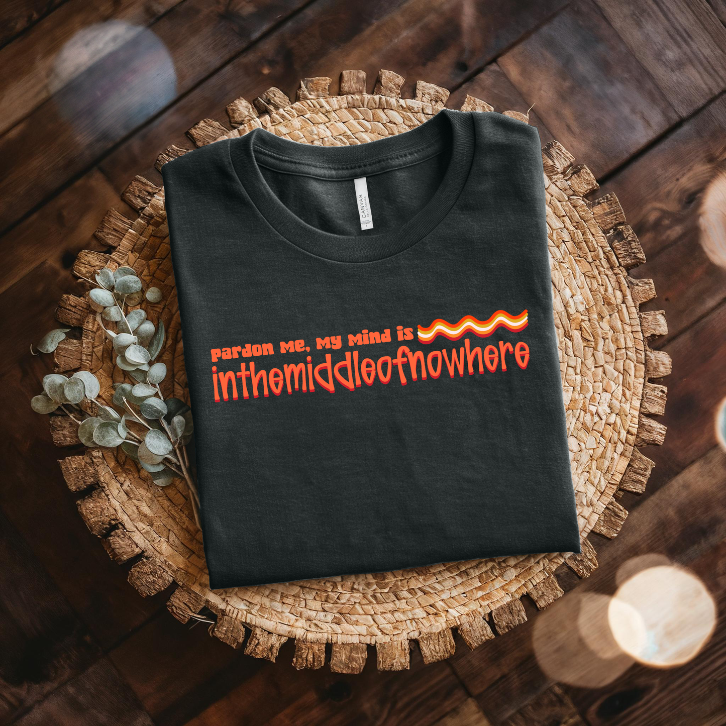 Black t-shirt with red text on a woven mat. funny quote shirt, sarcastic t shirt, unisex graphic tee, humor tee, funny saying shirt, casual quote shirt, statement tee, laid back shirt, daydreaming shirt, witty t shirt, gift idea shirt, funny unisex tee, everyday graphic tee, relaxed style shirt, humorous apparel