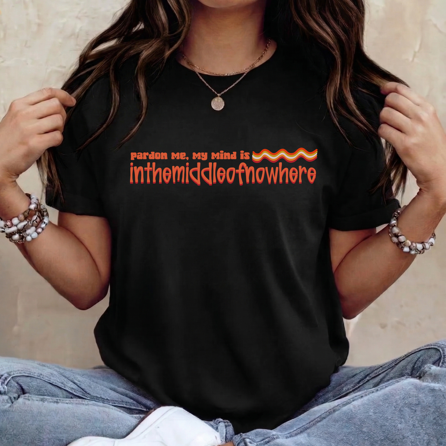 Person wearing a black t-shirt with orange text and flames design. funny quote shirt, sarcastic t shirt, unisex graphic tee, humor tee, funny saying shirt, casual quote shirt, statement tee, laid back shirt, daydreaming shirt, witty t shirt, gift idea shirt, funny unisex tee, everyday graphic tee, relaxed style shirt, humorous apparel
