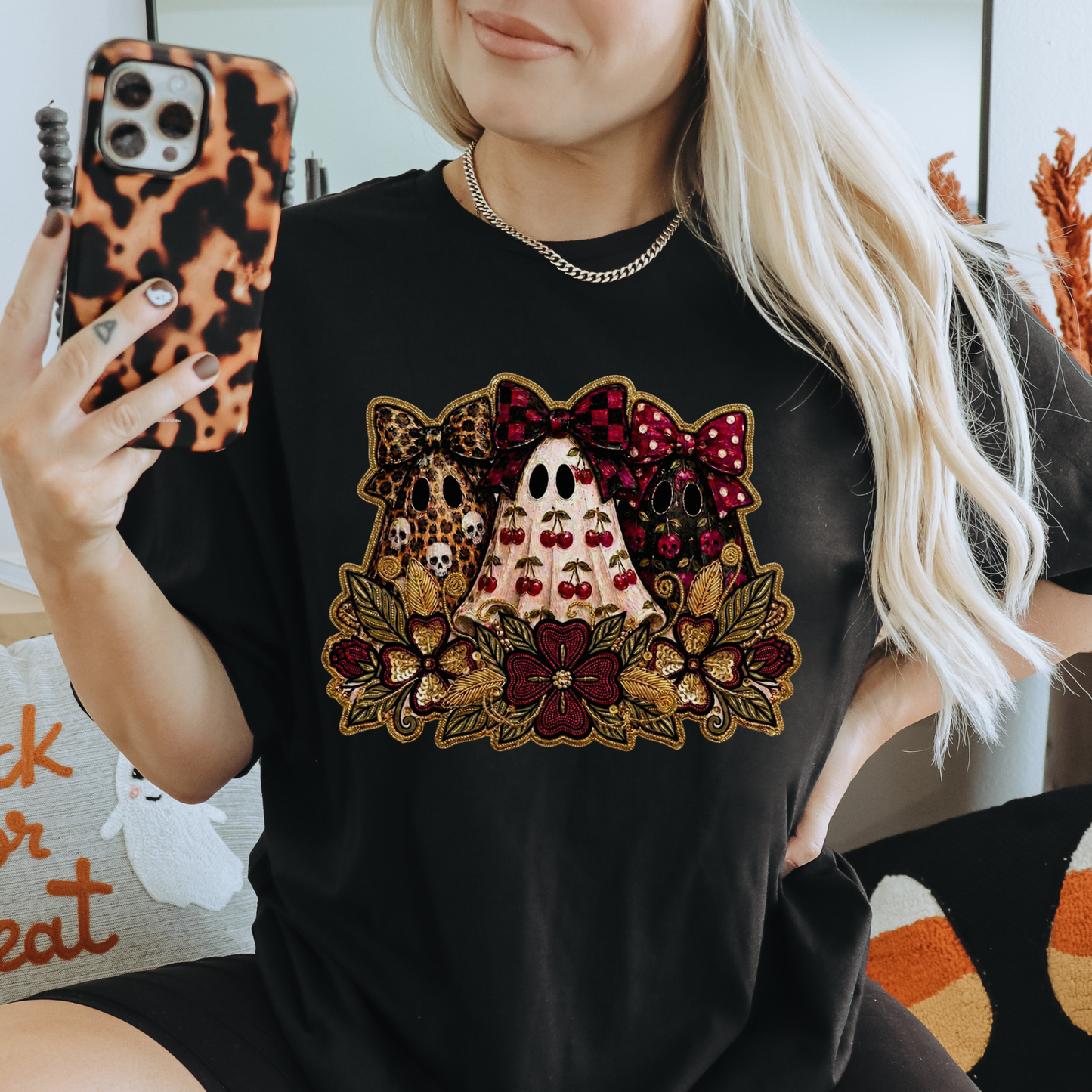 Cute Preppy Ghost Coquette Halloween Shirt featuring cherry, leopard, and floral bow ghosts with autumn florals. The perfect trendy fall graphic tee for pumpkin patch season and Halloween. preppy ghost shirt, coquette halloween shirt, cherry ghost shirt, cute halloween tee, ghost bow shirt, spooky season shirt, fall aesthetic shirt, pumpkin patch outfit, halloween graphic tee, floral ghost shirt, leopard bow ghost, autumn shirt, coquette fall shirt