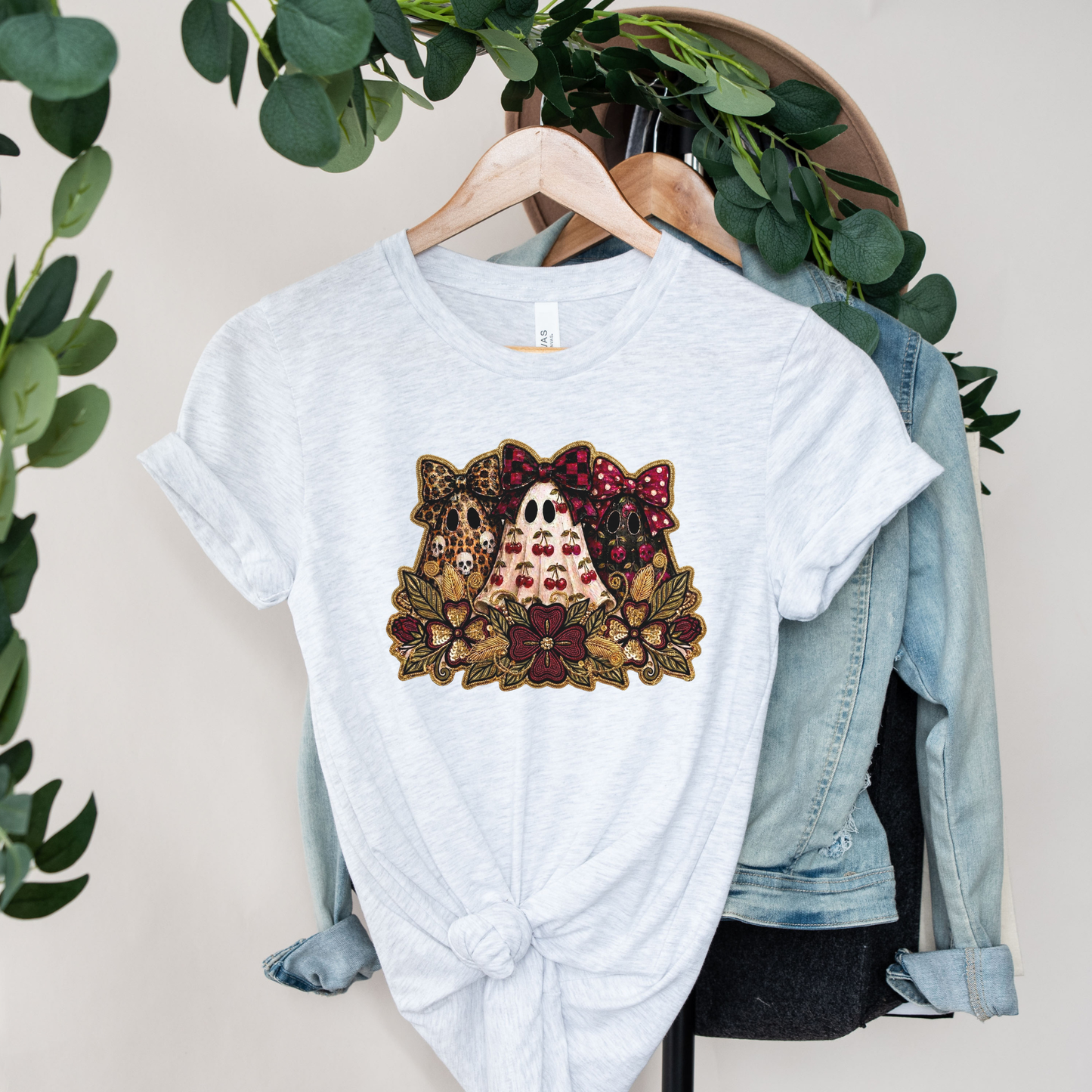 Cute Preppy Ghost Coquette Halloween Shirt featuring cherry, leopard, and floral bow ghosts with autumn florals. The perfect trendy fall graphic tee for pumpkin patch season and Halloween. preppy ghost shirt, coquette halloween shirt, cherry ghost shirt, cute halloween tee, ghost bow shirt, spooky season shirt, fall aesthetic shirt, pumpkin patch outfit, halloween graphic tee, floral ghost shirt, leopard bow ghost, autumn shirt, coquette fall shirt