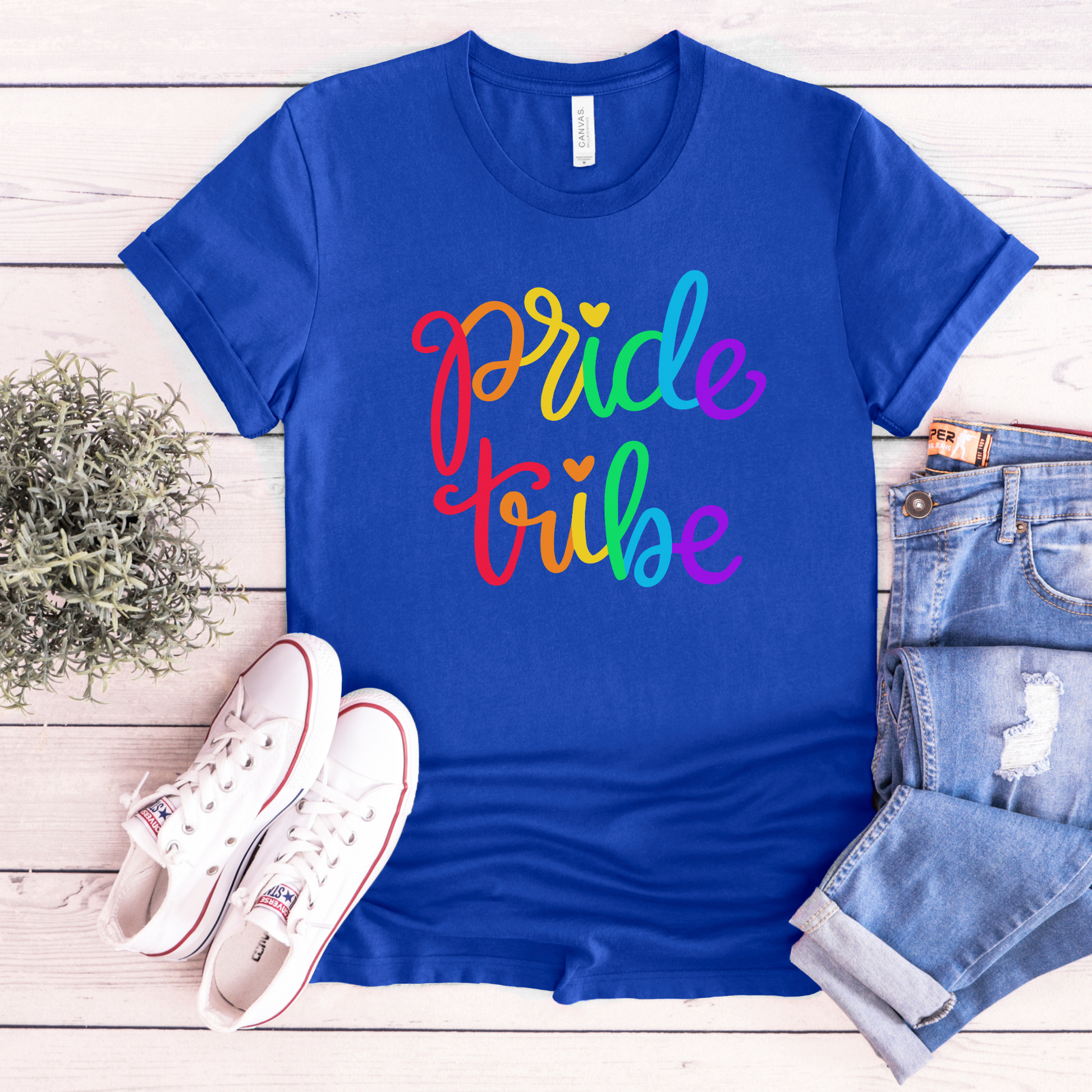 Pride Tribe unisex shirt with bold rainbow script text on a graphic tee. Pride Tribe shirt, rainbow pride shirt, LGBTQ pride tee, unisex graphic tee, pride apparel, rainbow shirt, statement tee, inclusive fashion, community shirt, pride outfit, LGBTQ support shirt, colorful script tee, gift for pride, everyday graphic tee, pride clothing