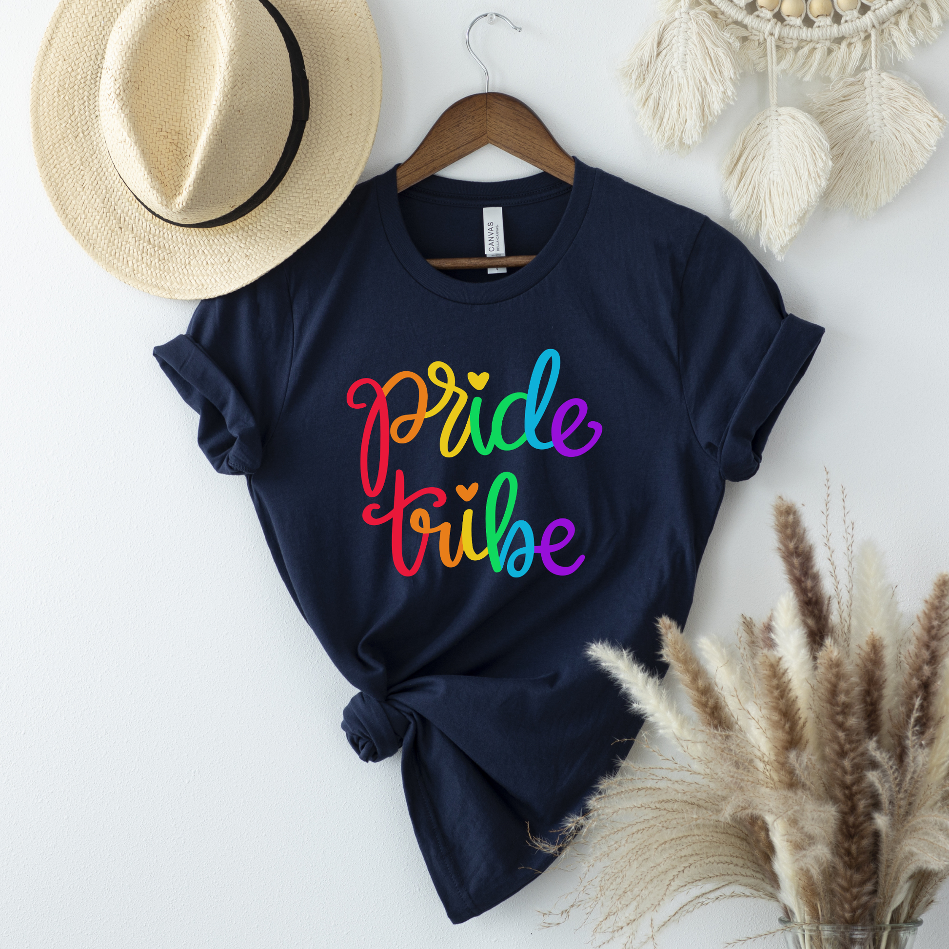 Pride Tribe unisex shirt with bold rainbow script text on a graphic tee. Pride Tribe shirt, rainbow pride shirt, LGBTQ pride tee, unisex graphic tee, pride apparel, rainbow shirt, statement tee, inclusive fashion, community shirt, pride outfit, LGBTQ support shirt, colorful script tee, gift for pride, everyday graphic tee, pride clothing