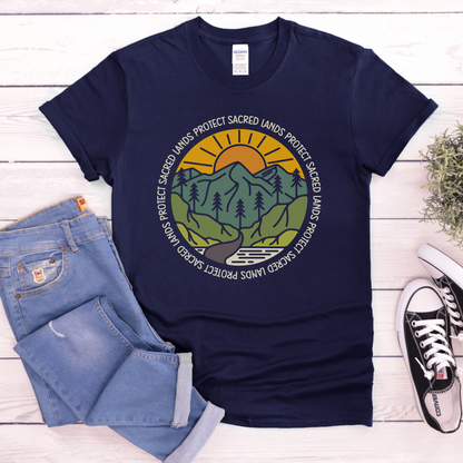 Protect Sacred Lands shirt featuring mountains, trees, water, and a rising sun surrounded by the words Protect Sacred Lands in a circular design. Protect Sacred Lands Shirt, Indigenous Advocacy Shirt, Environmental Awareness Shirt, Nature Conservation Apparel, Indigenous Land Stewardship, Protect The Land Shirt, Outdoor Graphic Tee, Conservation Clothing, Indigenous Ally Apparel, Nature Lover Gift