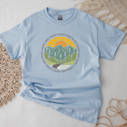 Protect Sacred Lands shirt featuring mountains, trees, water, and a rising sun surrounded by the words Protect Sacred Lands in a circular design. Protect Sacred Lands Shirt, Indigenous Advocacy Shirt, Environmental Awareness Shirt, Nature Conservation Apparel, Indigenous Land Stewardship, Protect The Land Shirt, Outdoor Graphic Tee, Conservation Clothing, Indigenous Ally Apparel, Nature Lover Gift