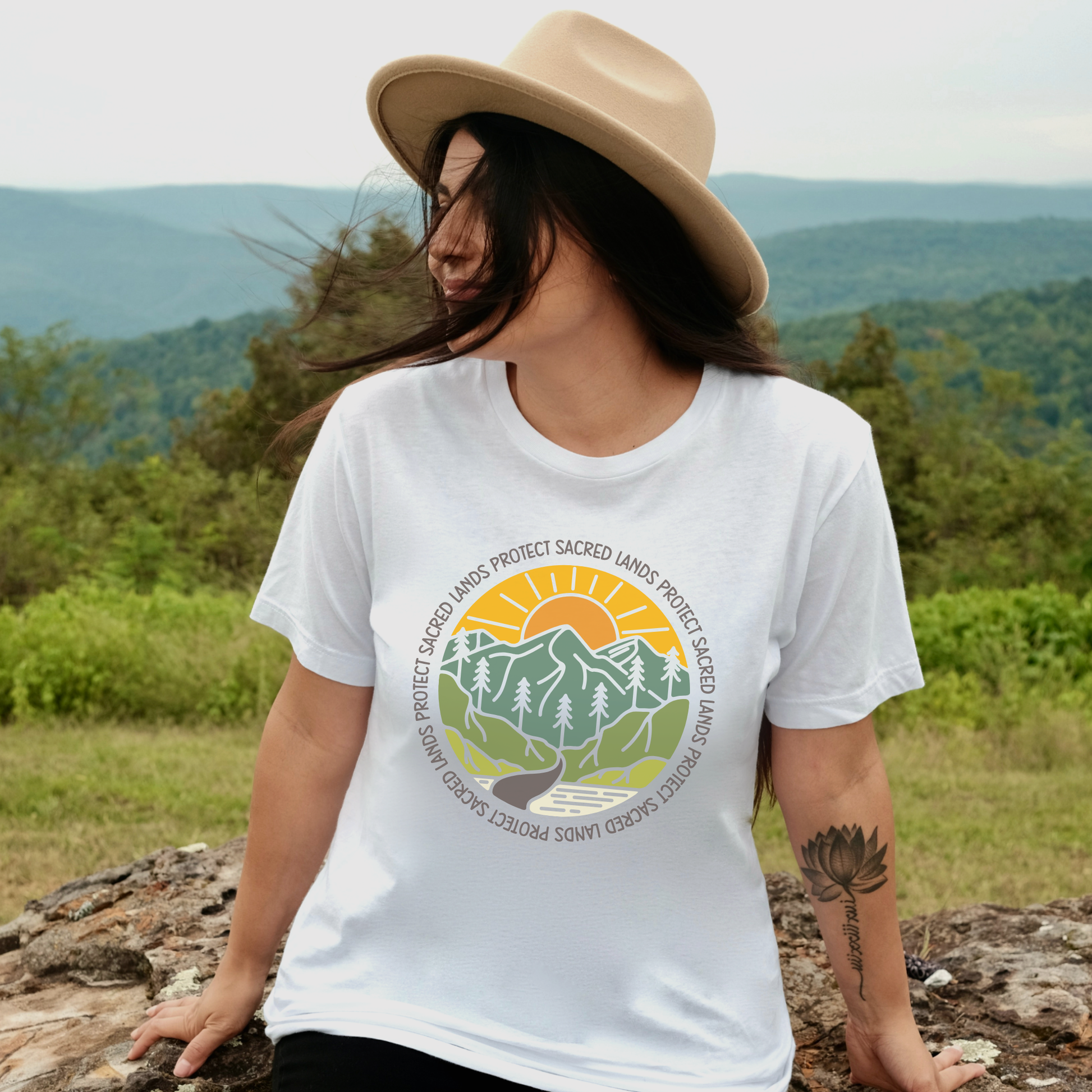 Protect Sacred Lands shirt featuring mountains, trees, water, and a rising sun surrounded by the words Protect Sacred Lands in a circular design. Protect Sacred Lands Shirt, Indigenous Advocacy Shirt, Environmental Awareness Shirt, Nature Conservation Apparel, Indigenous Land Stewardship, Protect The Land Shirt, Outdoor Graphic Tee, Conservation Clothing, Indigenous Ally Apparel, Nature Lover Gift