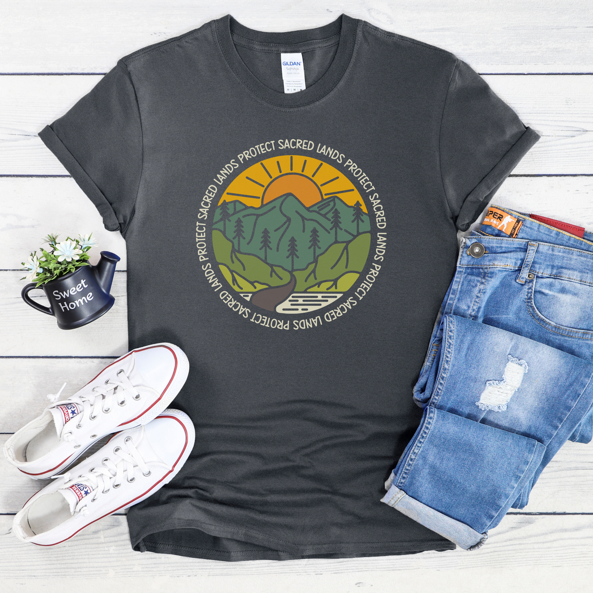 Protect Sacred Lands shirt featuring mountains, trees, water, and a rising sun surrounded by the words Protect Sacred Lands in a circular design. Protect Sacred Lands Shirt, Indigenous Advocacy Shirt, Environmental Awareness Shirt, Nature Conservation Apparel, Indigenous Land Stewardship, Protect The Land Shirt, Outdoor Graphic Tee, Conservation Clothing, Indigenous Ally Apparel, Nature Lover Gift