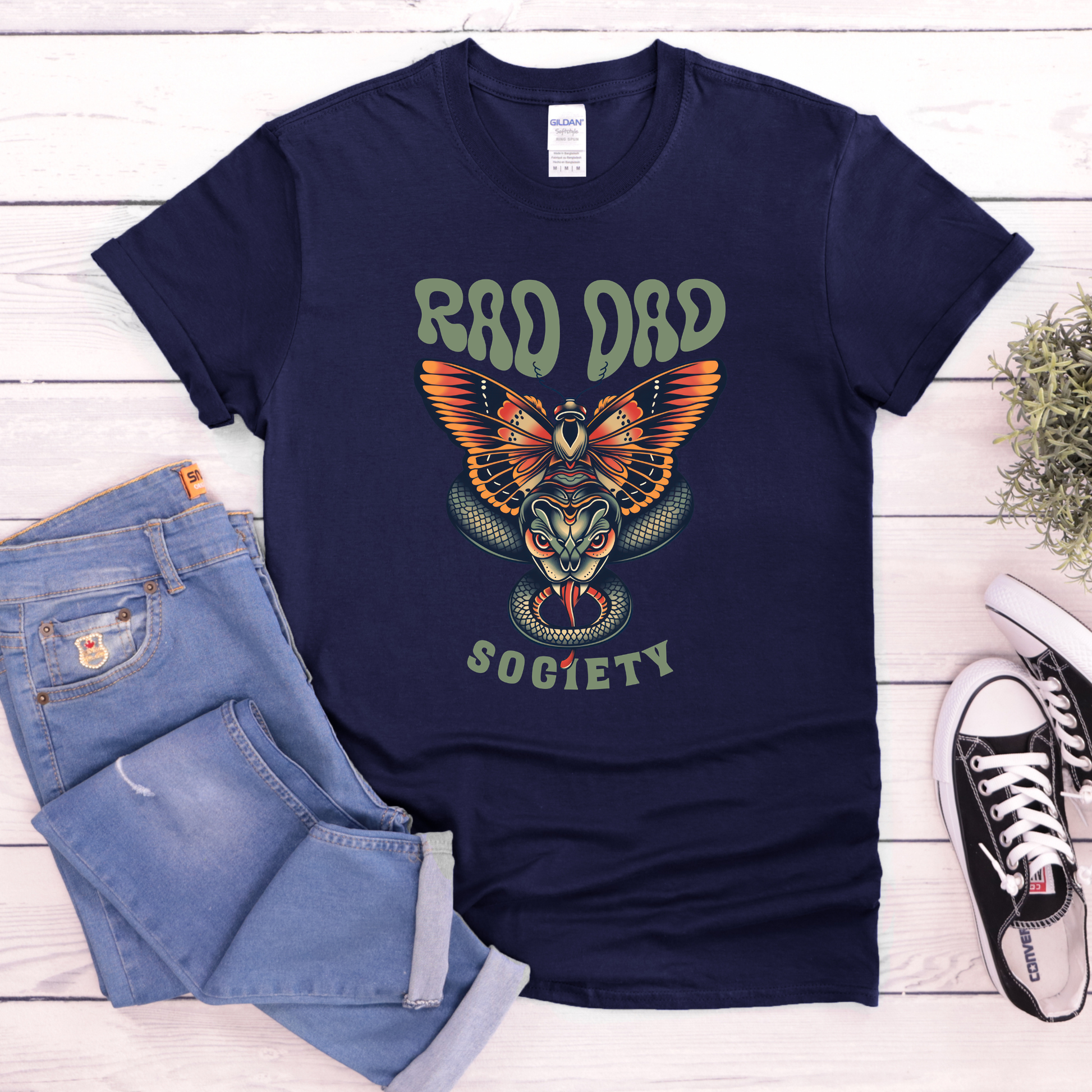Rad Dad Society shirt with moth and snake graphic on a unisex t-shirt.rad dad society, dad shirt, graphic tee, retro dad shirt, unisex t-shirt, moth and snake design, cool dad shirt, father gift, bold dad apparel, vintage style tee, unique dad shirt, everyday casual shirt, statement graphic tee, father’s day gift, rad dad tee