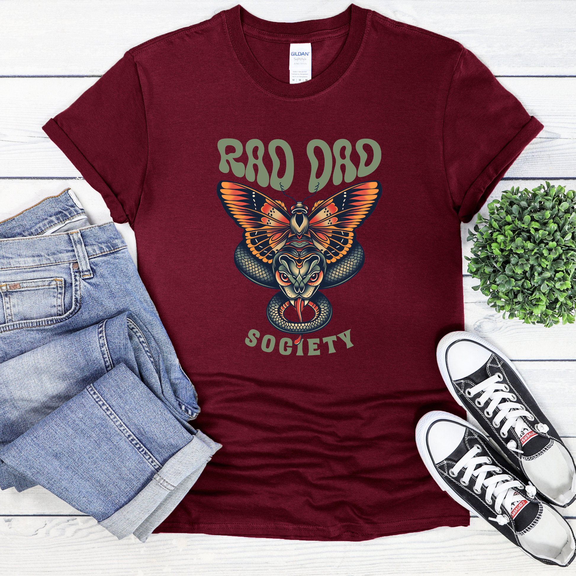 Rad Dad Society shirt with moth and snake graphic on a unisex t-shirt.rad dad society, dad shirt, graphic tee, retro dad shirt, unisex t-shirt, moth and snake design, cool dad shirt, father gift, bold dad apparel, vintage style tee, unique dad shirt, everyday casual shirt, statement graphic tee, father’s day gift, rad dad tee