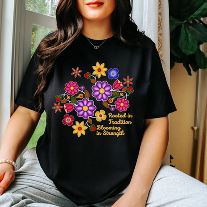 Rooted In Tradition Blooming In Strength shirt, Indigenous floral shirt, Indigenous inspired apparel, Indigenous owned clothing brand, Indigenous small business Canada, cultural graphic tee, floral graphic t-shirt, meaningful quote shirt, Sahdeh Spruce apparel, Indigenous pride clothing, Canadian Indigenous clothing brand, inspirational cultural shirt, made to order clothing, eco conscious apparel