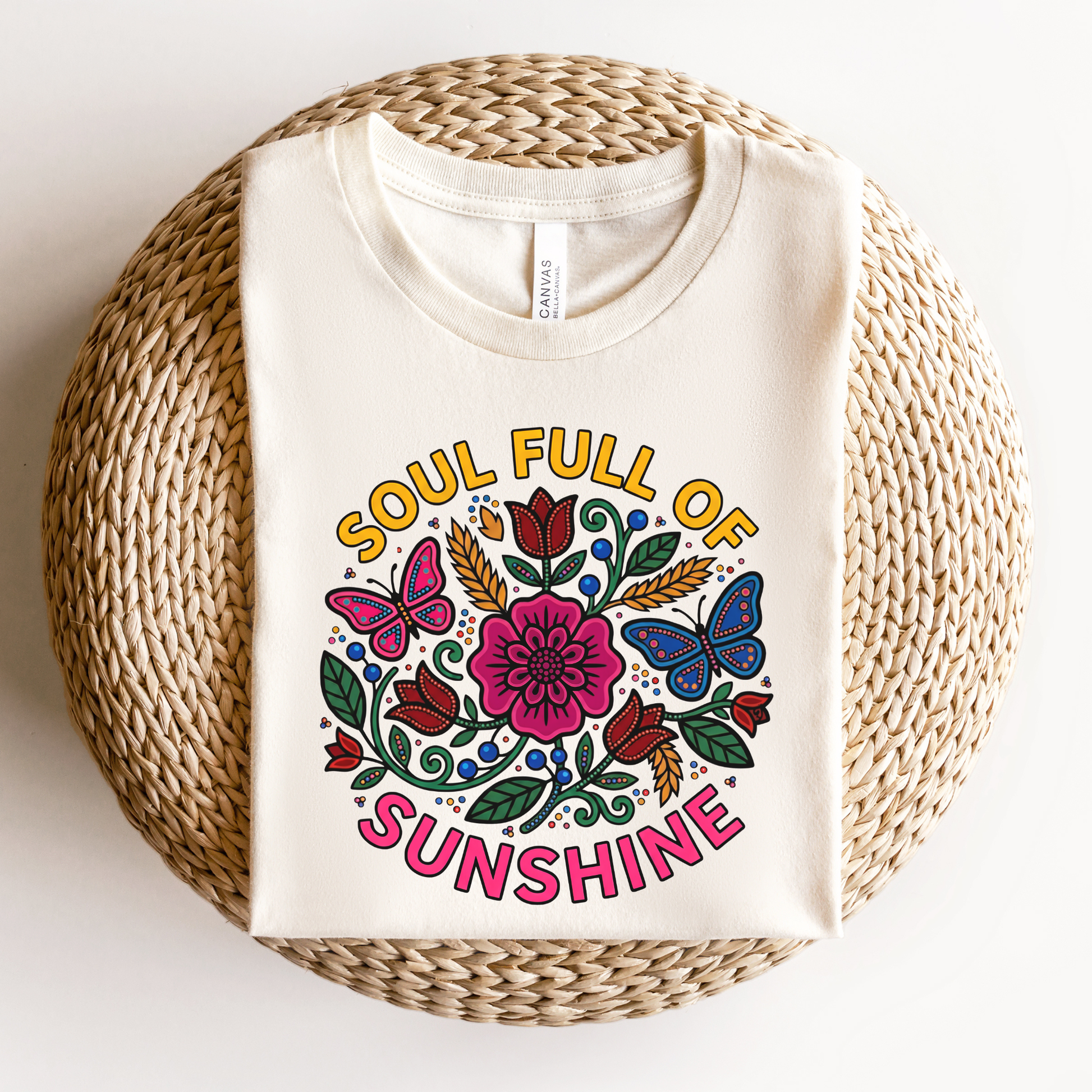 t-shirt featuring colorful Indigenous-inspired floral artwork, butterflies, and the phrase "Soul Full of Sunshine" in a vibrant circular design. soul full of sunshine shirt, Indigenous floral shirt, woodland floral shirt, butterfly shirt, floral graphic tee, colorful floral shirt, positive vibes shirt, sunshine shirt, Indigenous inspired apparel, nature lover shirt, boho floral tee, cottagecore shirt, botanical shirt, wildflower shirt, spring graphic tee, summer shirt, butterfly lover gift, floral aesthetic