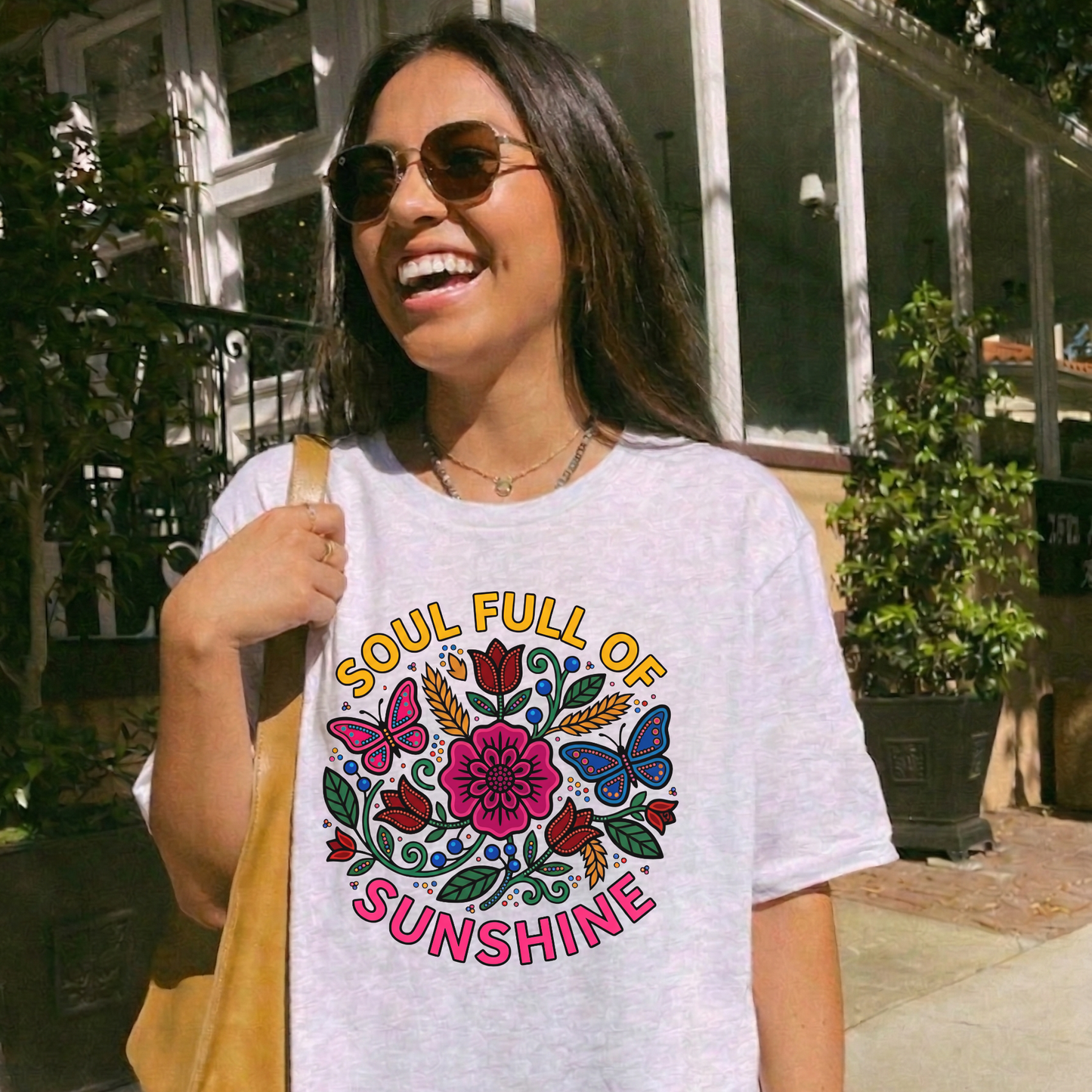 t-shirt featuring colorful Indigenous-inspired floral artwork, butterflies, and the phrase "Soul Full of Sunshine" in a vibrant circular design. soul full of sunshine shirt, Indigenous floral shirt, woodland floral shirt, butterfly shirt, floral graphic tee, colorful floral shirt, positive vibes shirt, sunshine shirt, Indigenous inspired apparel, nature lover shirt, boho floral tee, cottagecore shirt, botanical shirt, wildflower shirt, spring graphic tee, summer shirt, butterfly lover gift, floral aesthetic