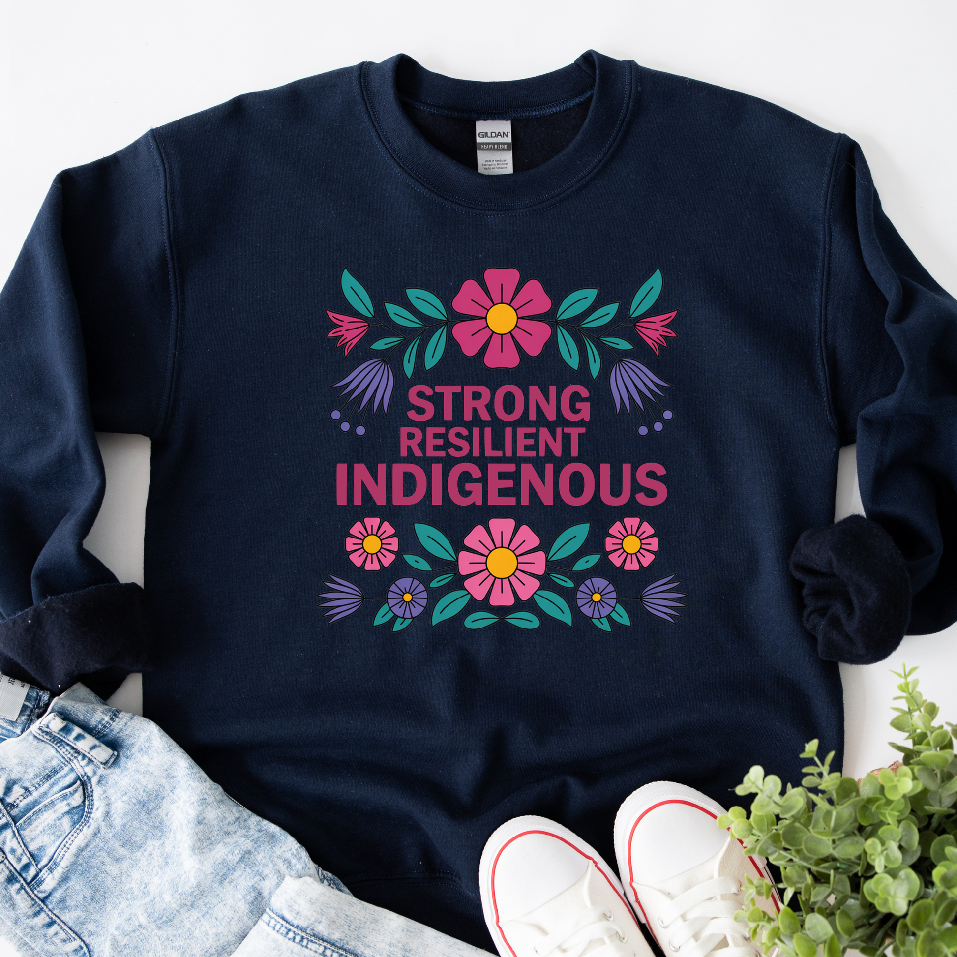 navy sweatshirt with floral design and text 'Strong Resilient Indigenous' strong resilient indigenous sweatshirt, indigenous floral crewneck, resilience sweatshirt indigenous, floral indigenous hoodie alternative, unisex indigenous sweatshirt, sahdeh spruce sweatshirts, indigenous pride pullover, native resilience fleece, indigenous artist sweatshirt, cultural strength crewneck, empowerment floral sweatshirt